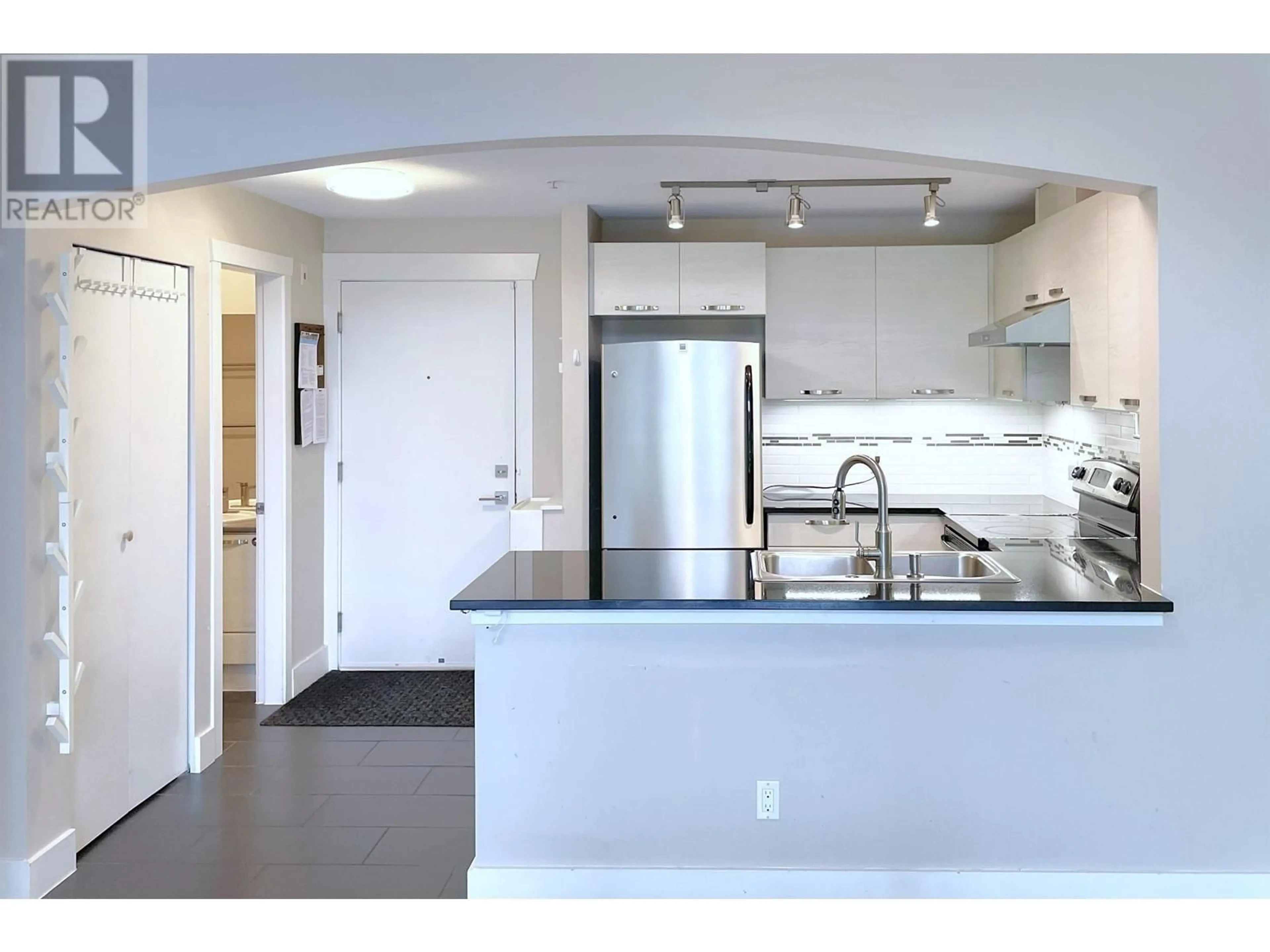 Open concept kitchen, unknown for 405 - 7488 BYRNEPARK WALK, Burnaby British Columbia V3N0B6