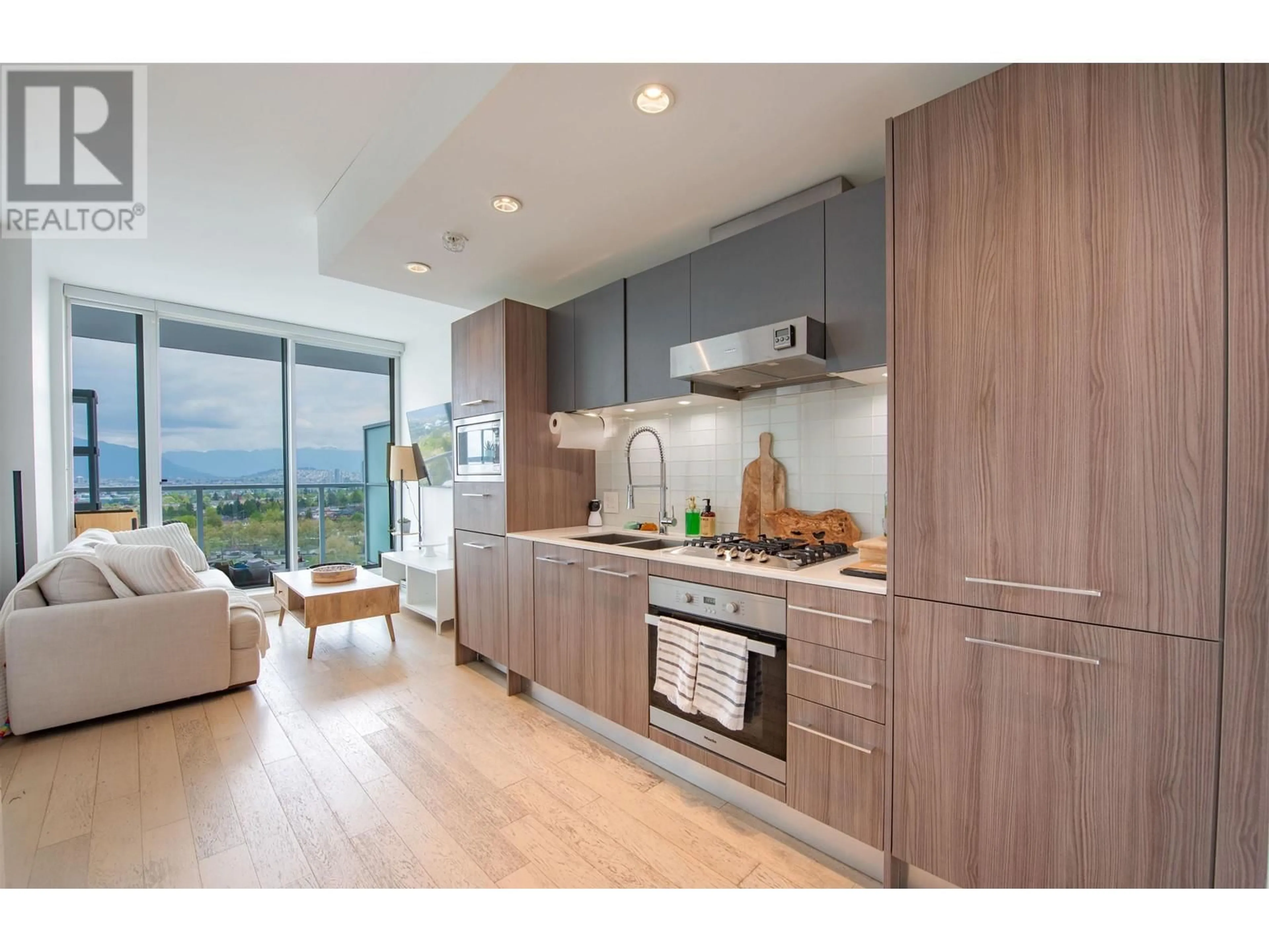 Open concept kitchen, wood/laminate floor for 1703 - 2220 KINGSWAY, Vancouver British Columbia V5N2T7