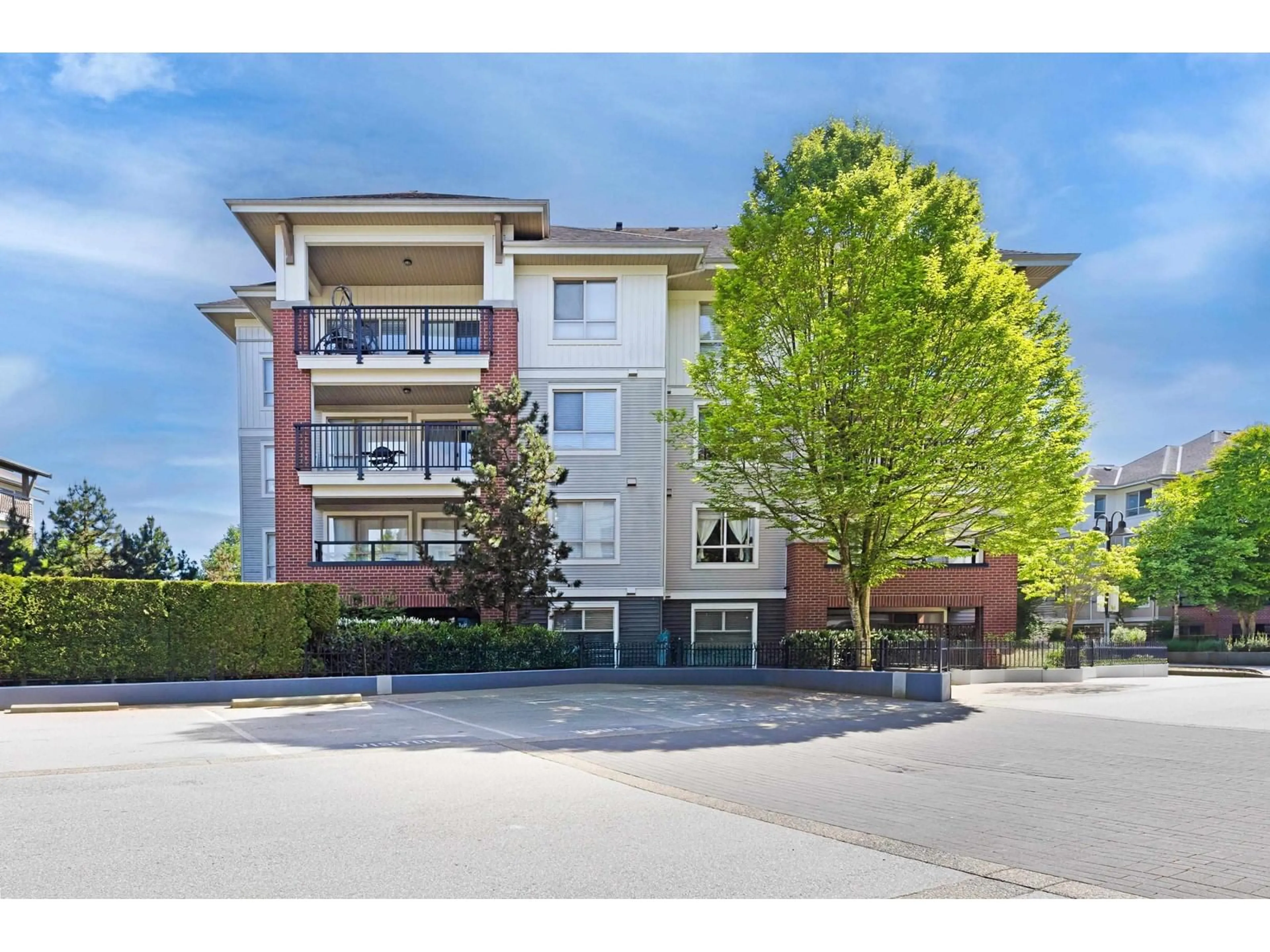 A pic from outside/outdoor area/front of a property/back of a property/a pic from drone, street for A205 - 8929 202, Langley British Columbia V1M0B4