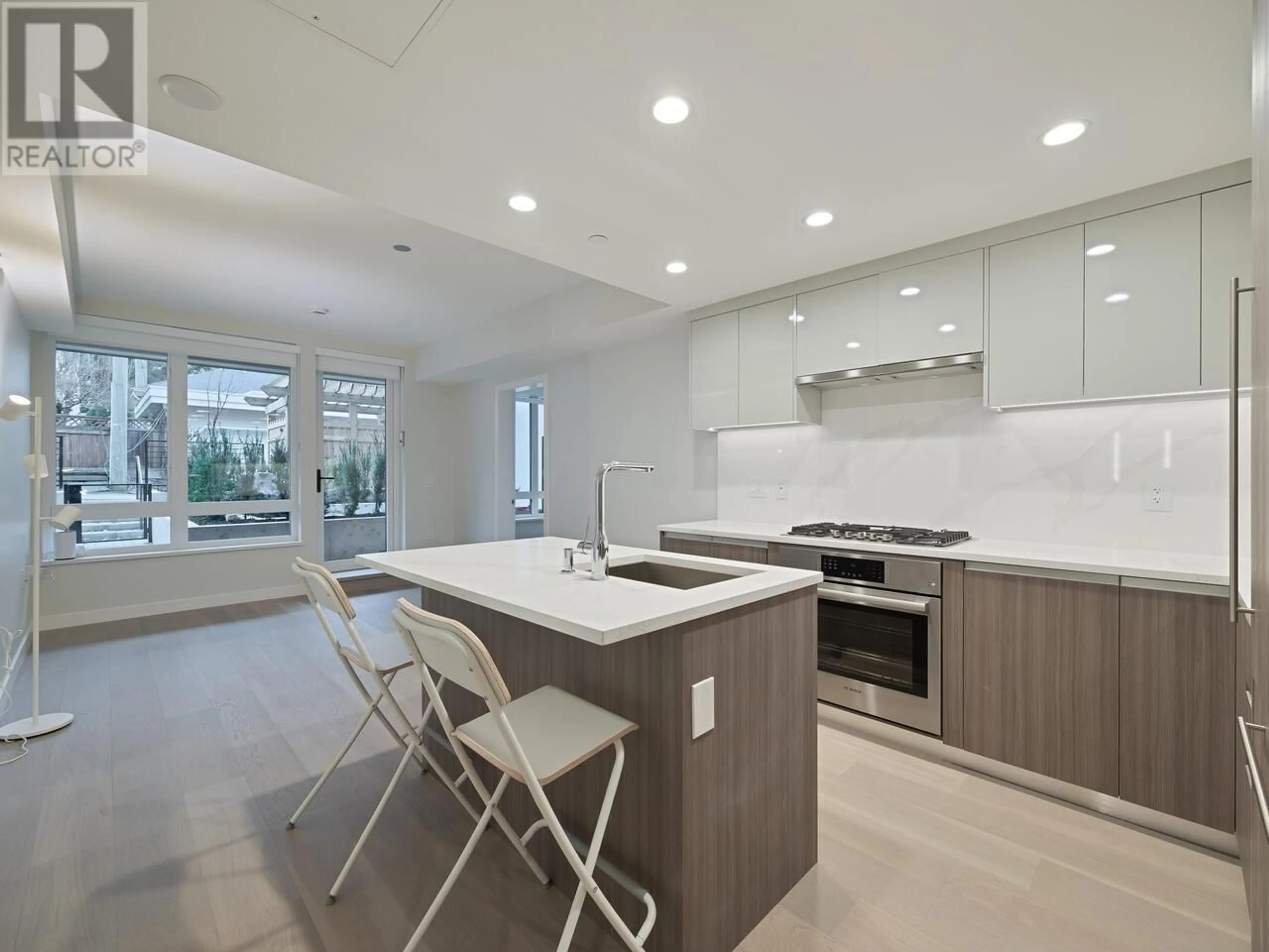 Open concept kitchen, ceramic/tile floor for 103 - 485 WEST 63RD AVENUE, Vancouver British Columbia V5X2J3