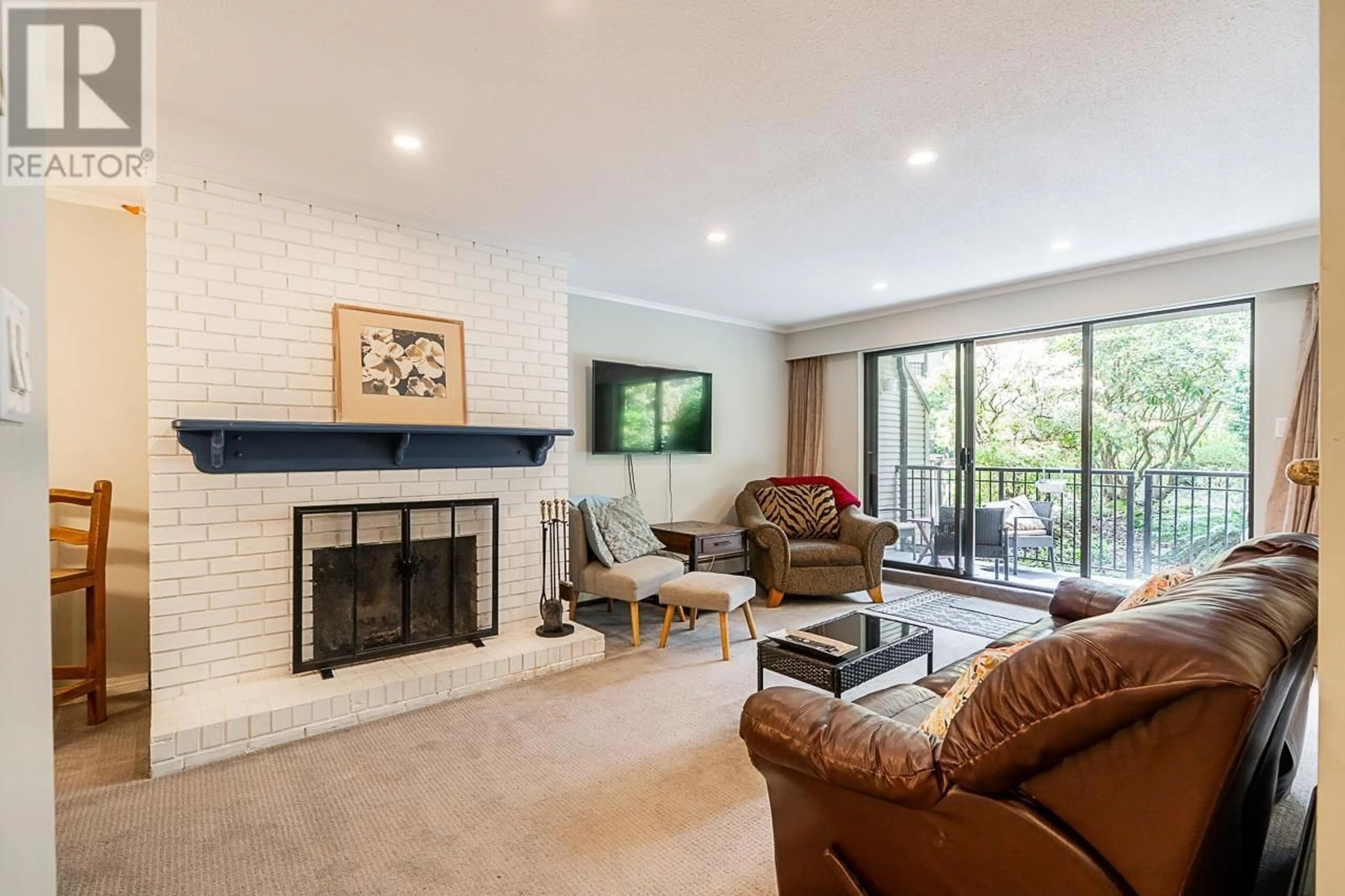 Living room with furniture, unknown for 201 - 1385 DRAYCOTT ROAD, North Vancouver British Columbia V7J3K9