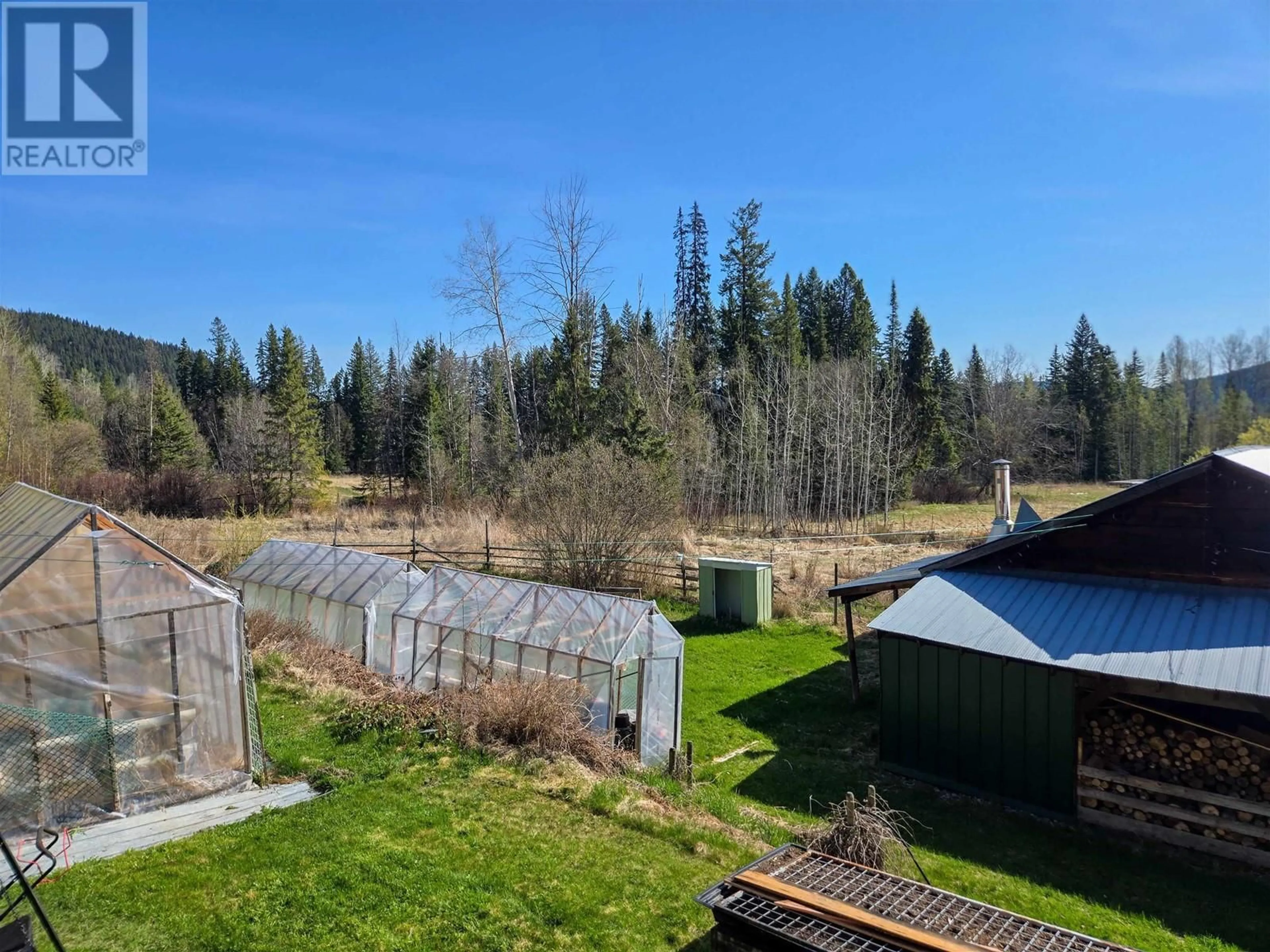 A pic from outside/outdoor area/front of a property/back of a property/a pic from drone, forest/trees view for 4014 CANIM-HENDRIX LAKE ROAD, Canim Lake British Columbia V0K1J0