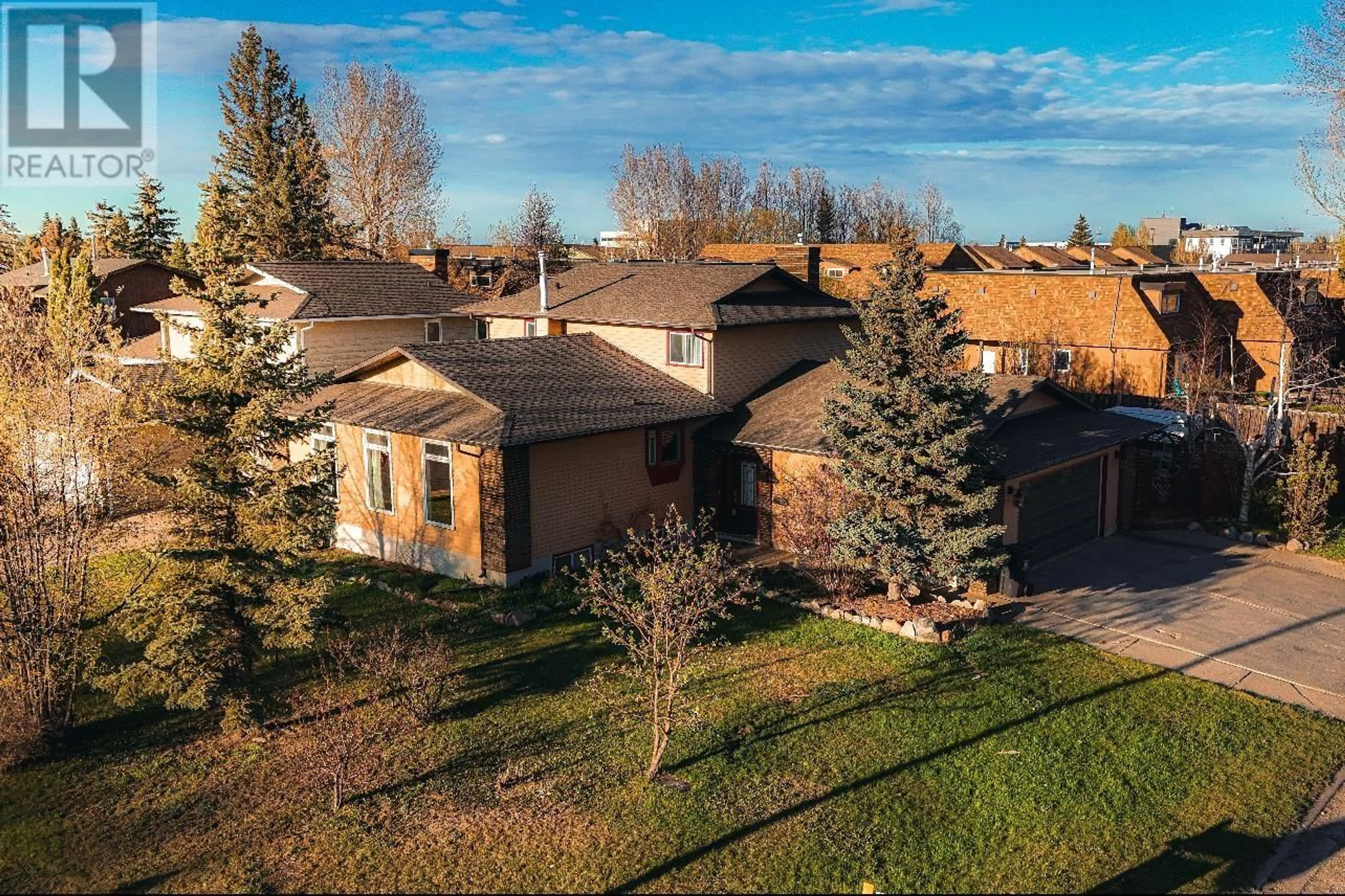 A pic from outside/outdoor area/front of a property/back of a property/a pic from drone, unknown for 10603 104 STREET, Fort St. John British Columbia V1J5G9