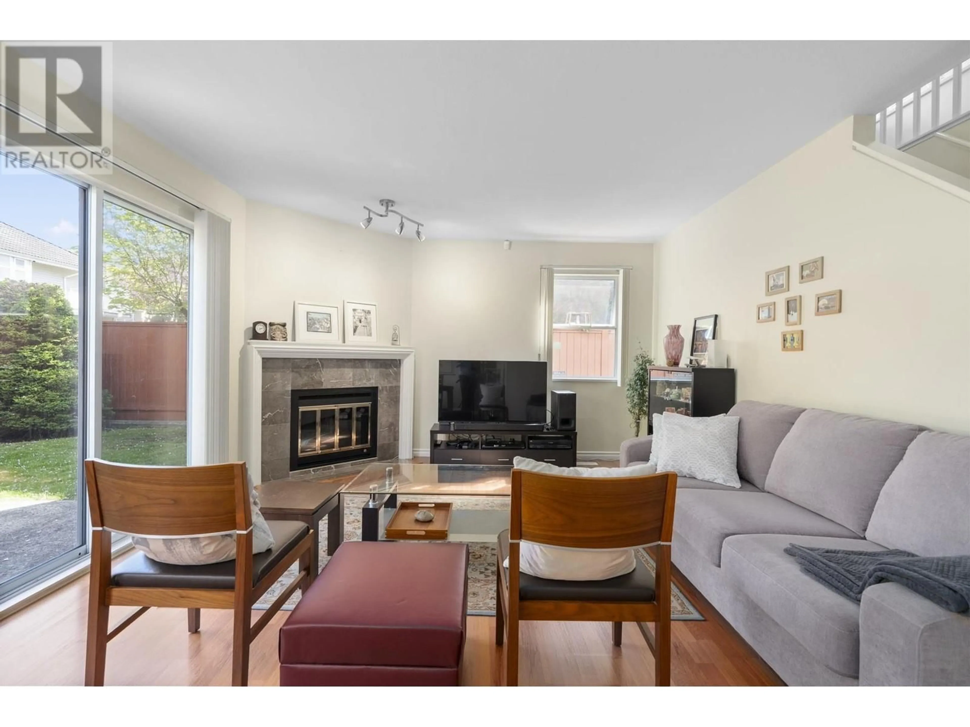 Living room with furniture, wood/laminate floor for 4 - 7640 GILBERT ROAD, Richmond British Columbia V7C3W2