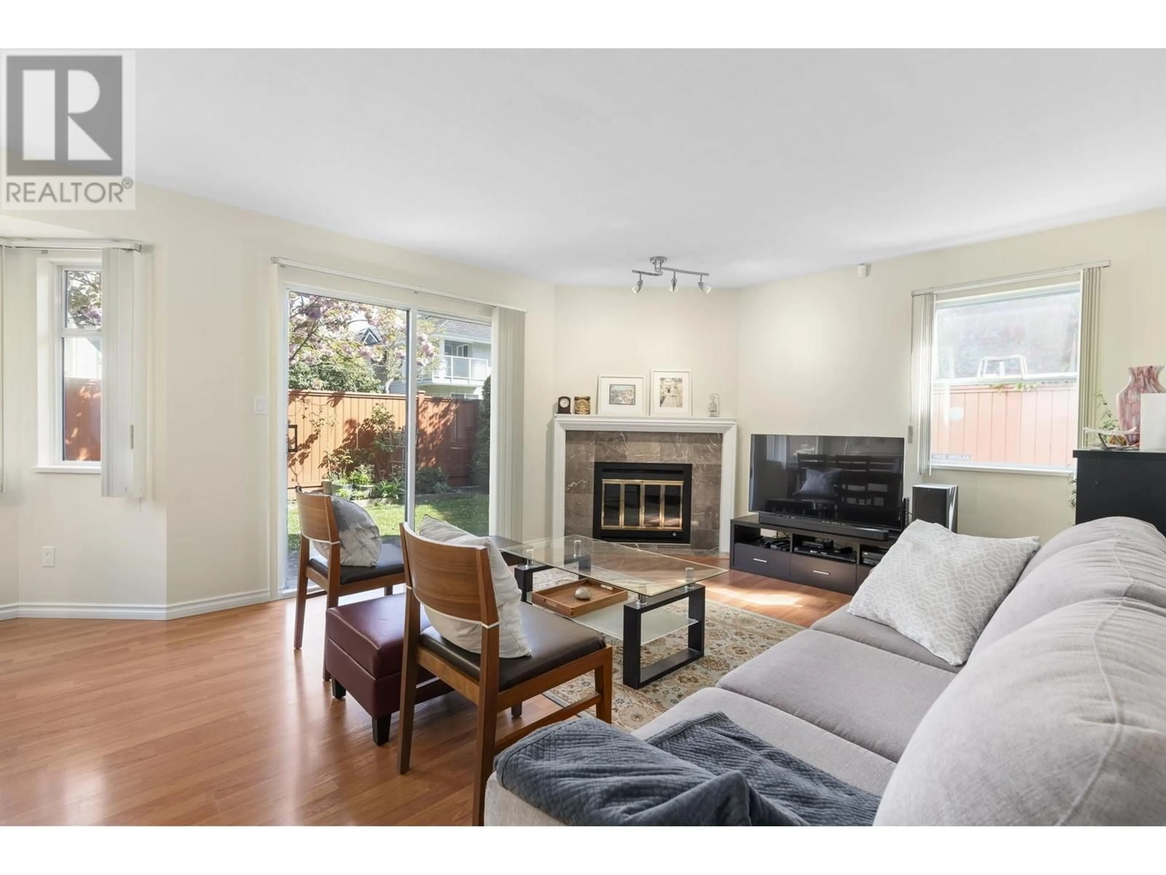 Living room with furniture, wood/laminate floor for 4 - 7640 GILBERT ROAD, Richmond British Columbia V7C3W2