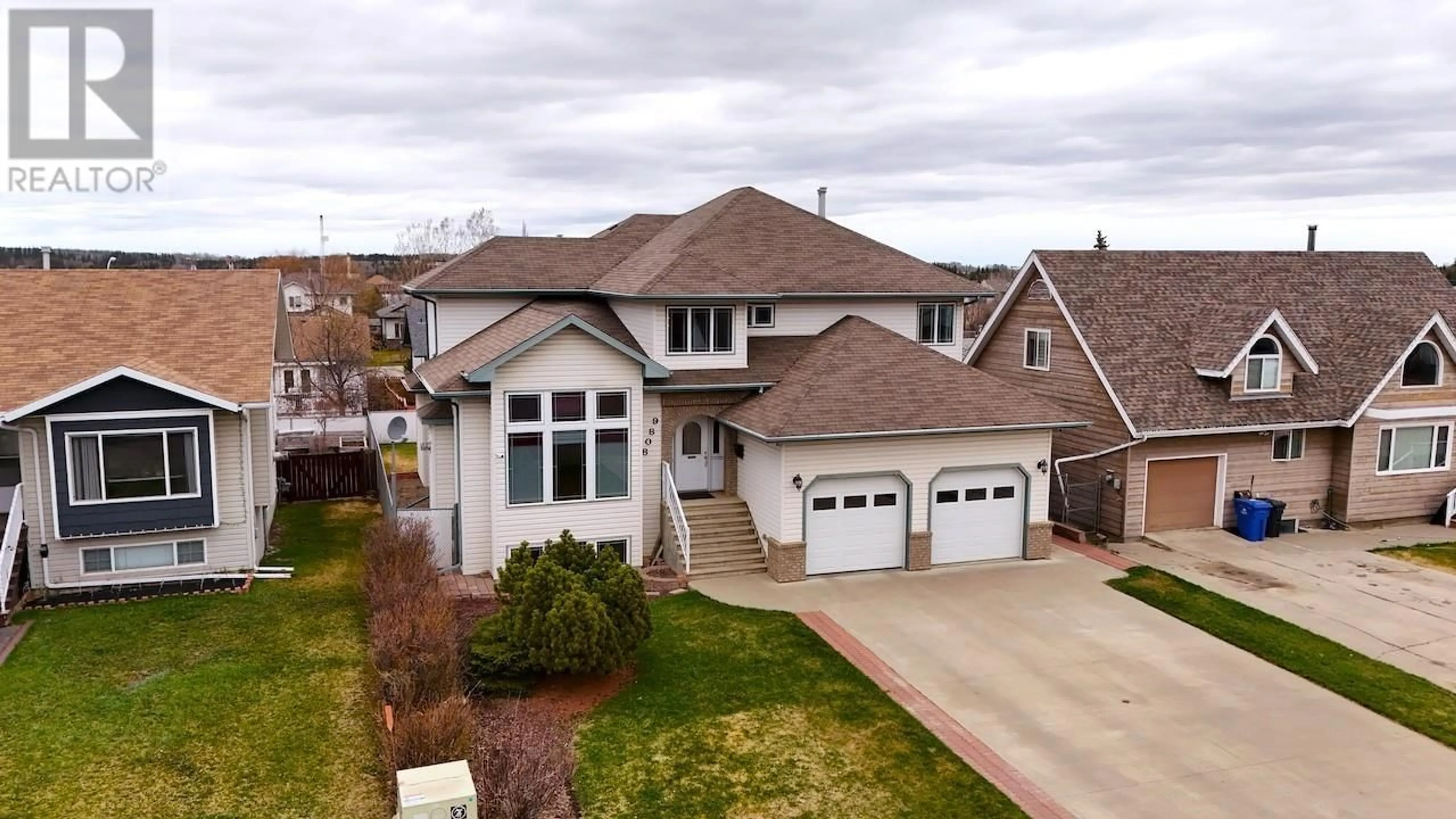 A pic from outside/outdoor area/front of a property/back of a property/a pic from drone, street for 9808 114 AVENUE, Fort St. John British Columbia V1J6L6