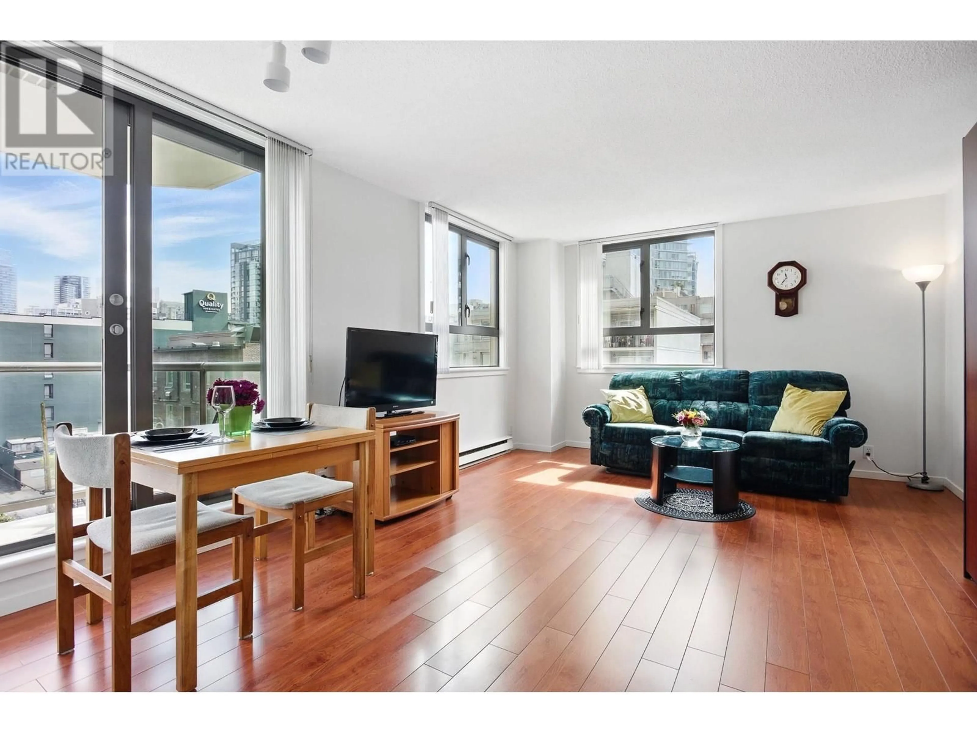 Living room with furniture, wood/laminate floor for 508 - 789 DRAKE STREET, Vancouver British Columbia V6Z2N7