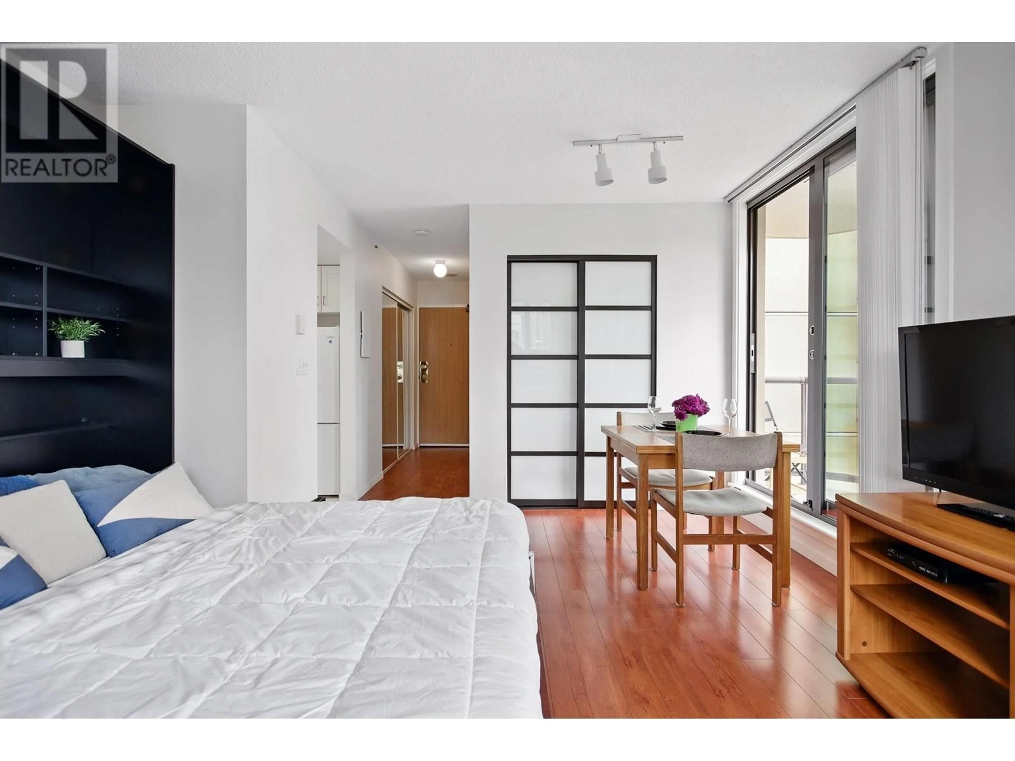 Bedroom with bed, wood/laminate floor for 508 - 789 DRAKE STREET, Vancouver British Columbia V6Z2N7
