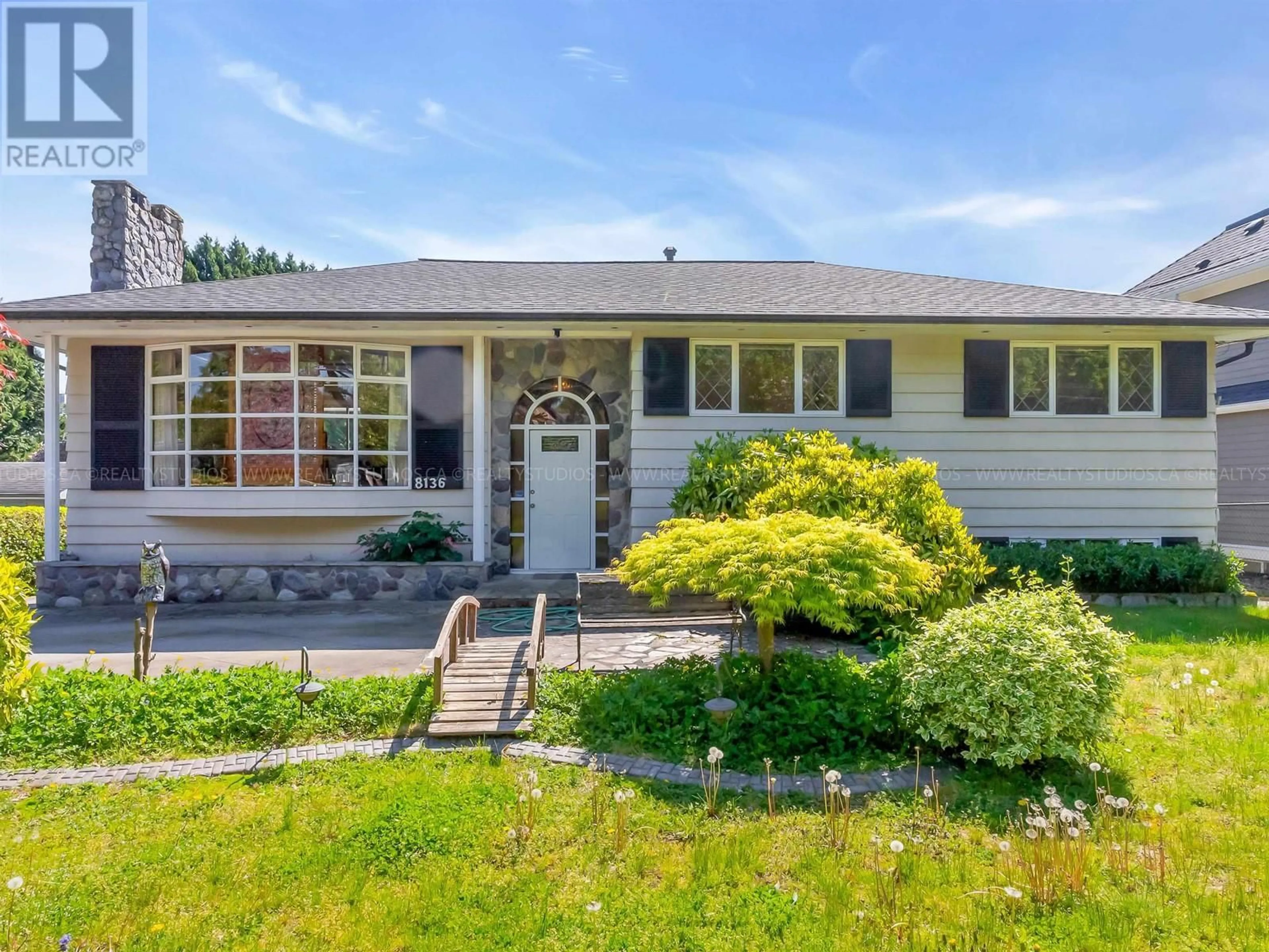 Home with vinyl exterior material, street for 8136 GOVERNMENT ROAD, Burnaby British Columbia V5A2E2