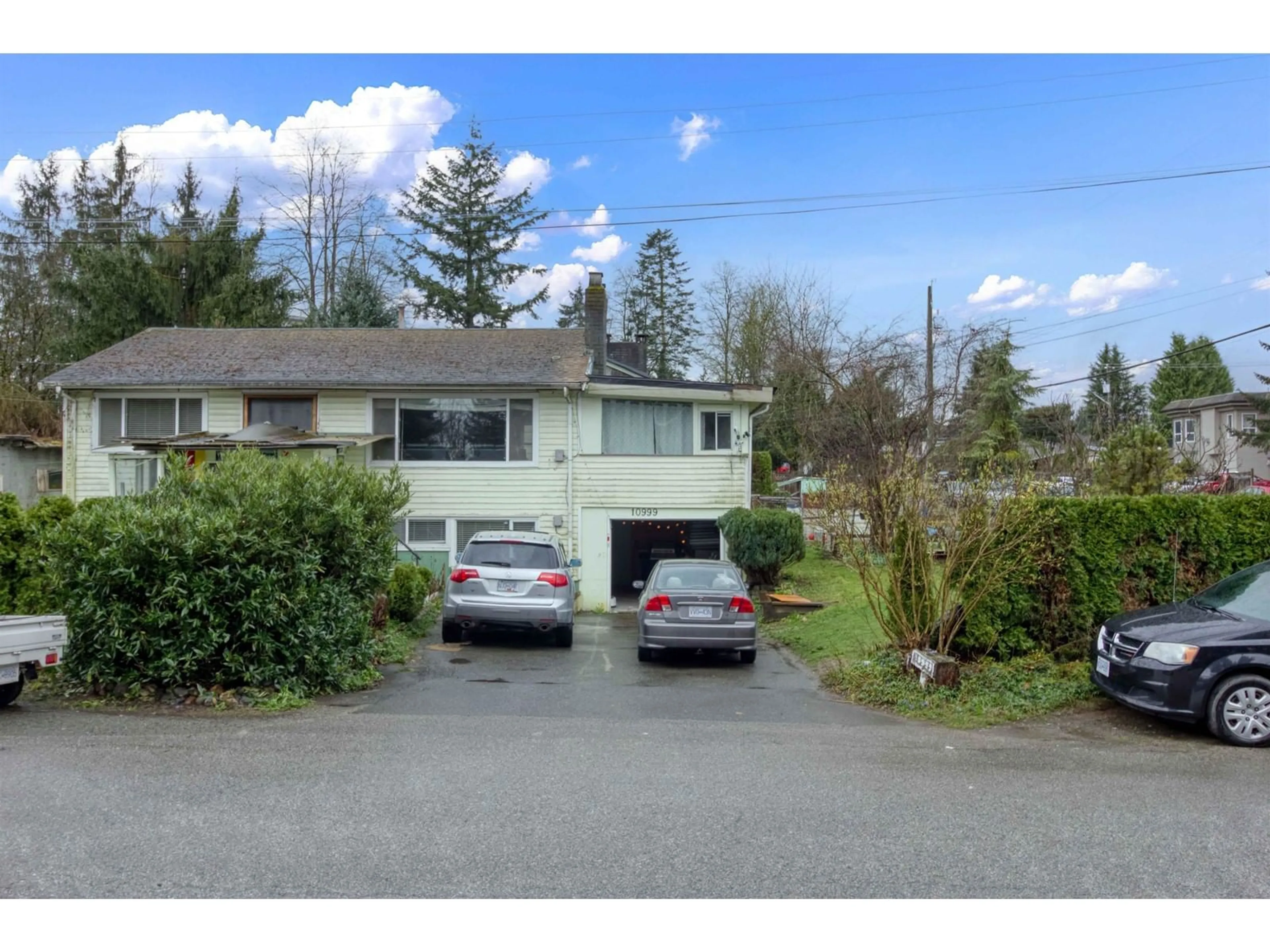 A pic from outside/outdoor area/front of a property/back of a property/a pic from drone, street for 10999 132A, Surrey British Columbia V3T3Y2