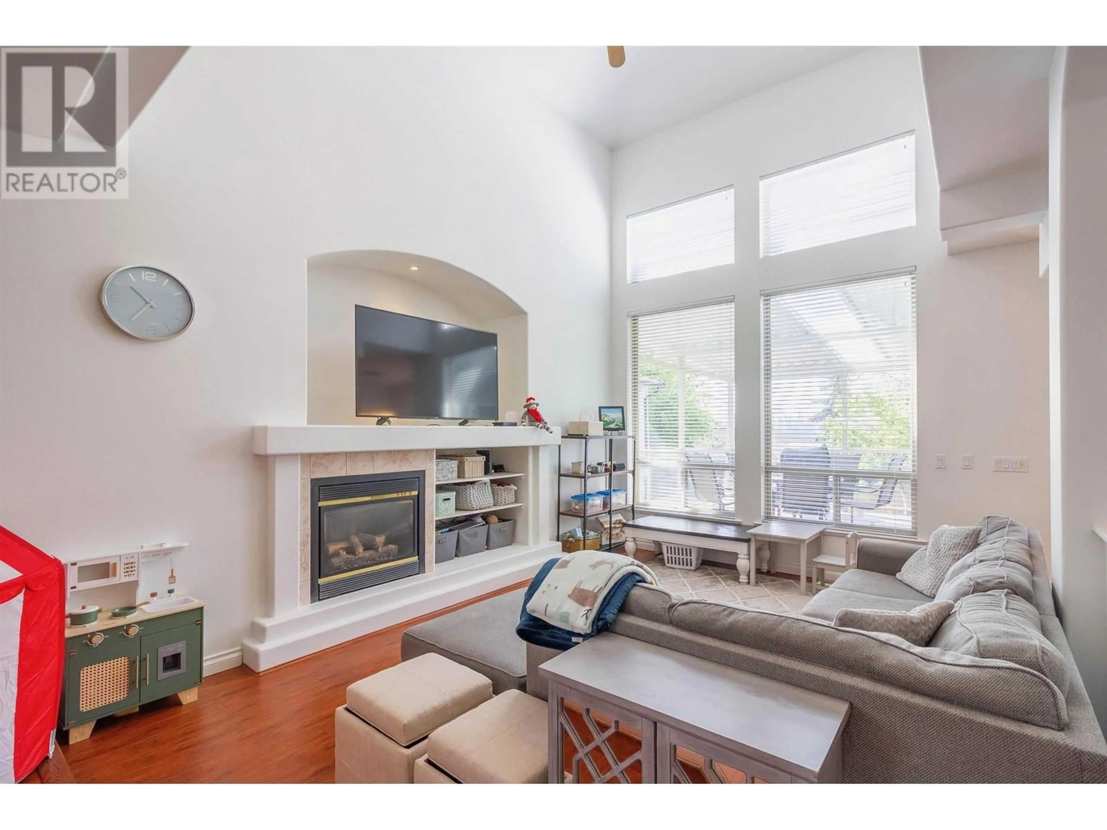 Living room with furniture, wood/laminate floor for 1004 QUADLING AVENUE, Coquitlam British Columbia V3K2A8