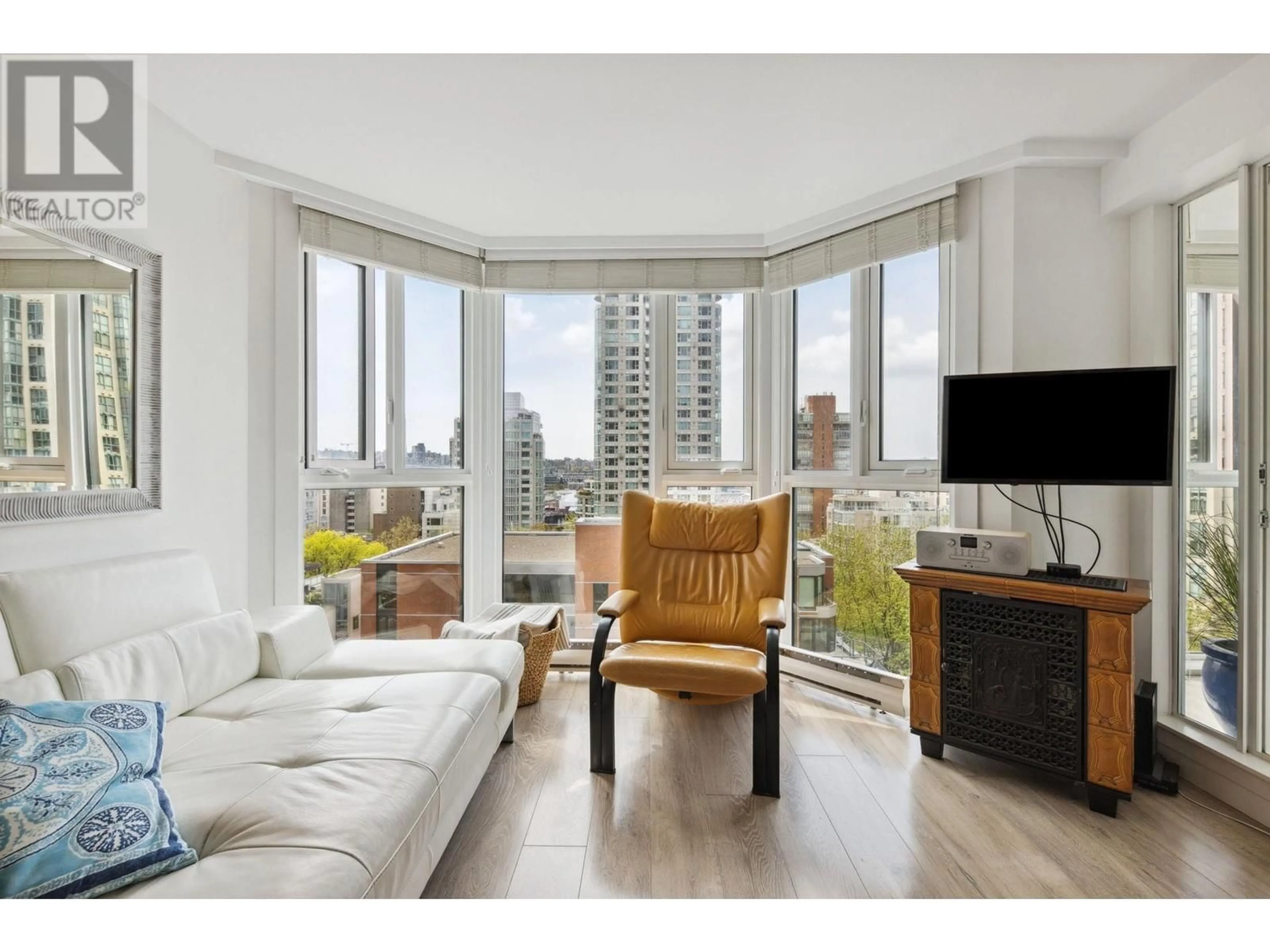 Living room with furniture, wood/laminate floor for 709 - 888 PACIFIC STREET, Vancouver British Columbia V6Z2S6