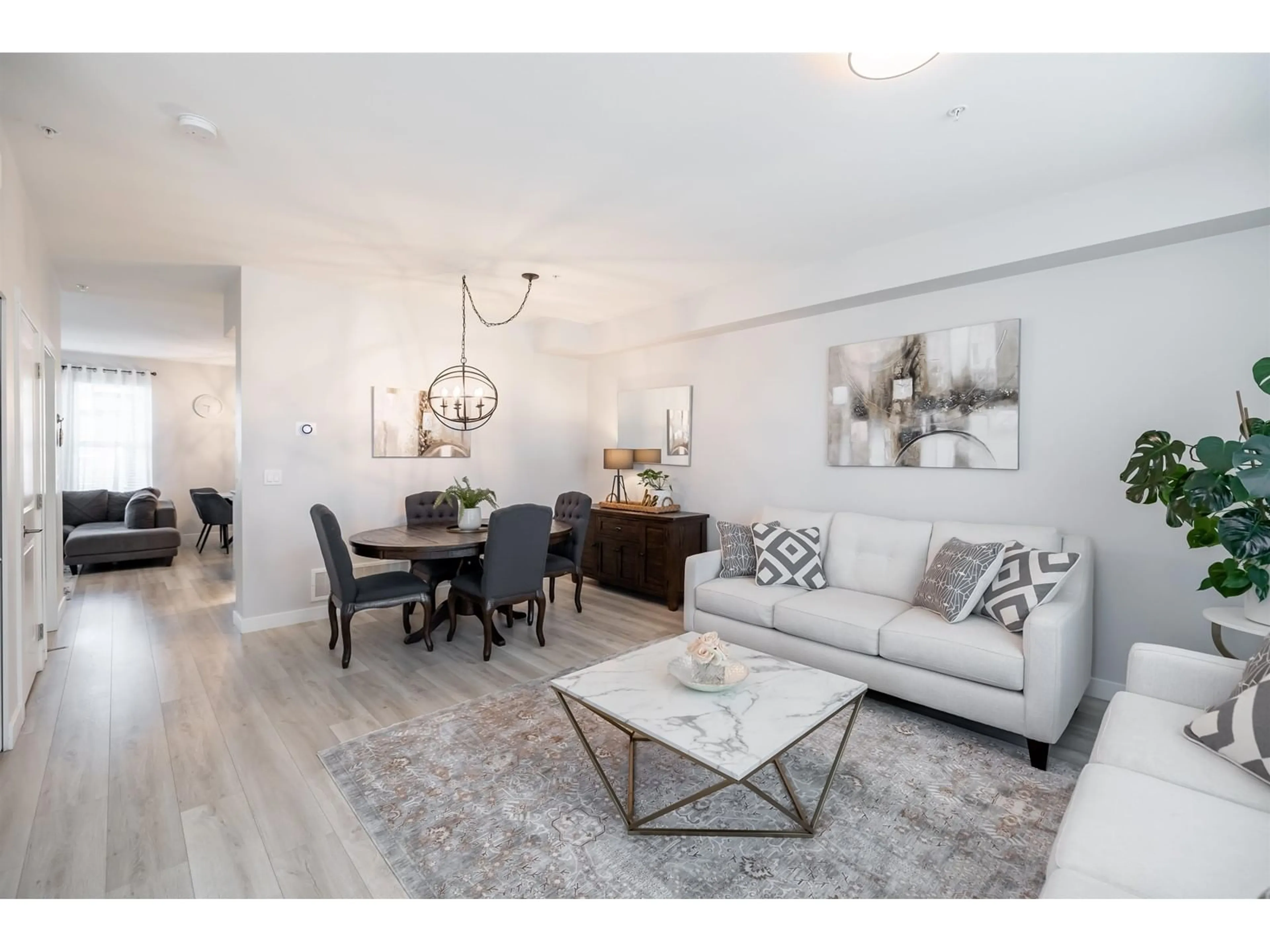 Living room with furniture, wood/laminate floor for 20267 82B, Langley British Columbia V2Y0Y8