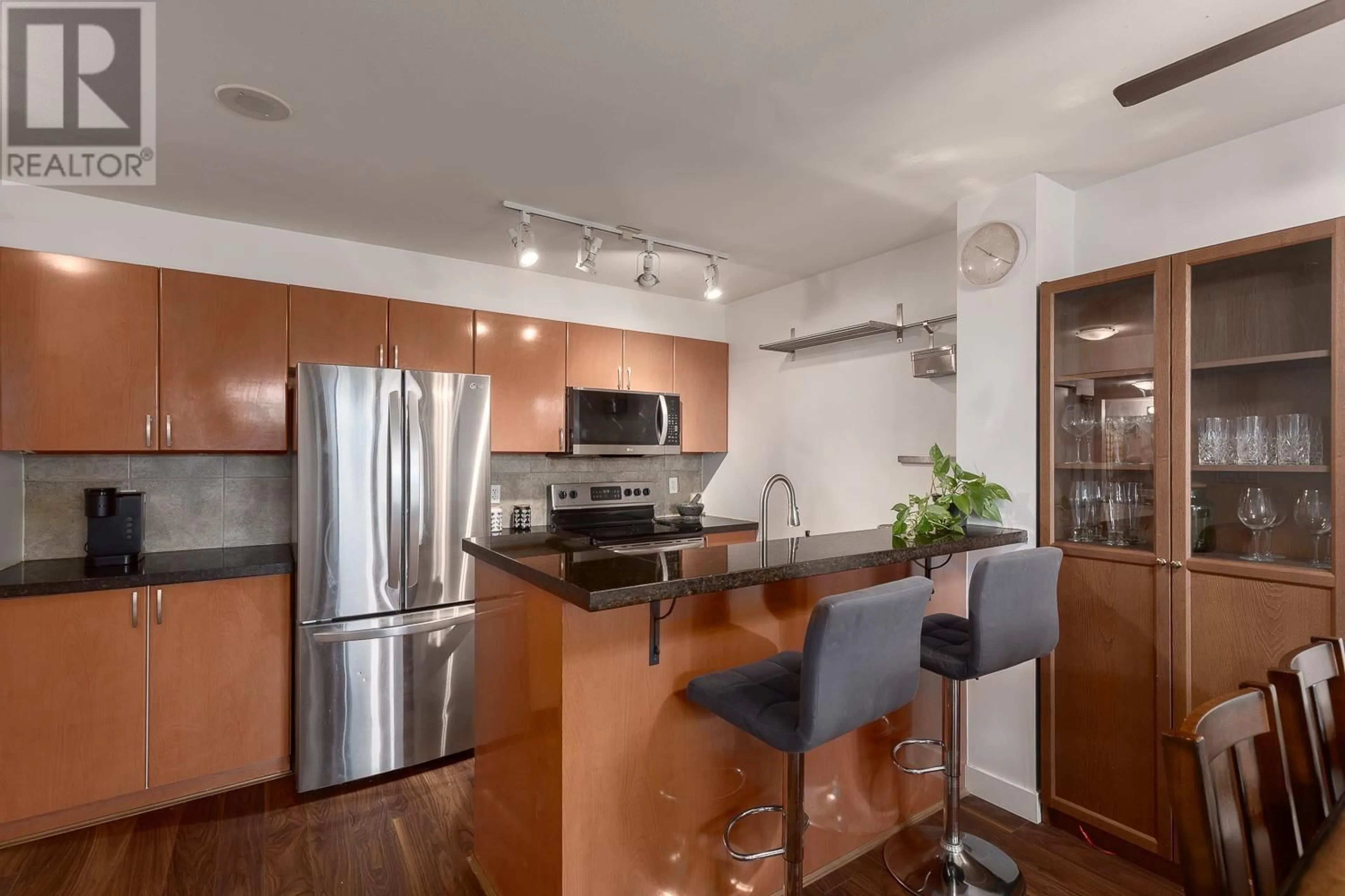 Open concept kitchen, wood/laminate floor for 1109 - 2763 CHANDLERY PLACE, Vancouver British Columbia V5S4V4