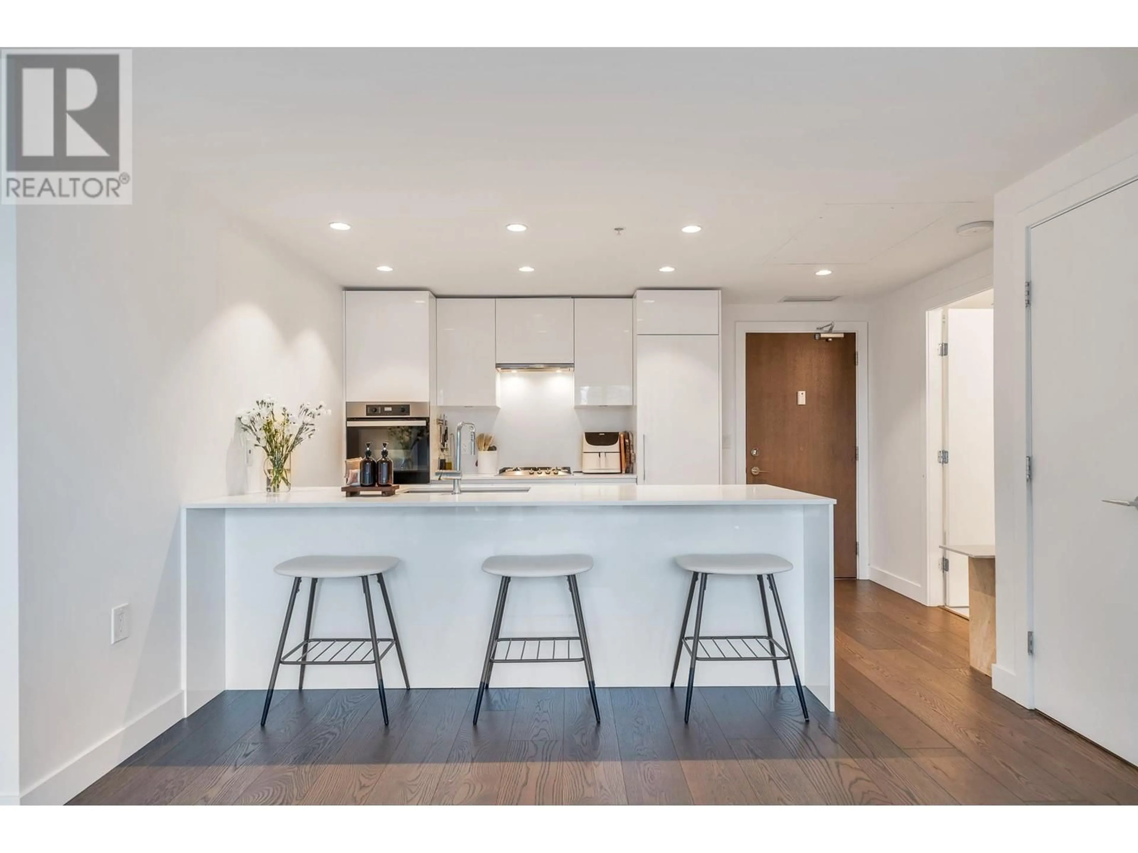 Open concept kitchen, wood/laminate floor for 607 - 5766 GILBERT ROAD, Richmond British Columbia V7C0G2