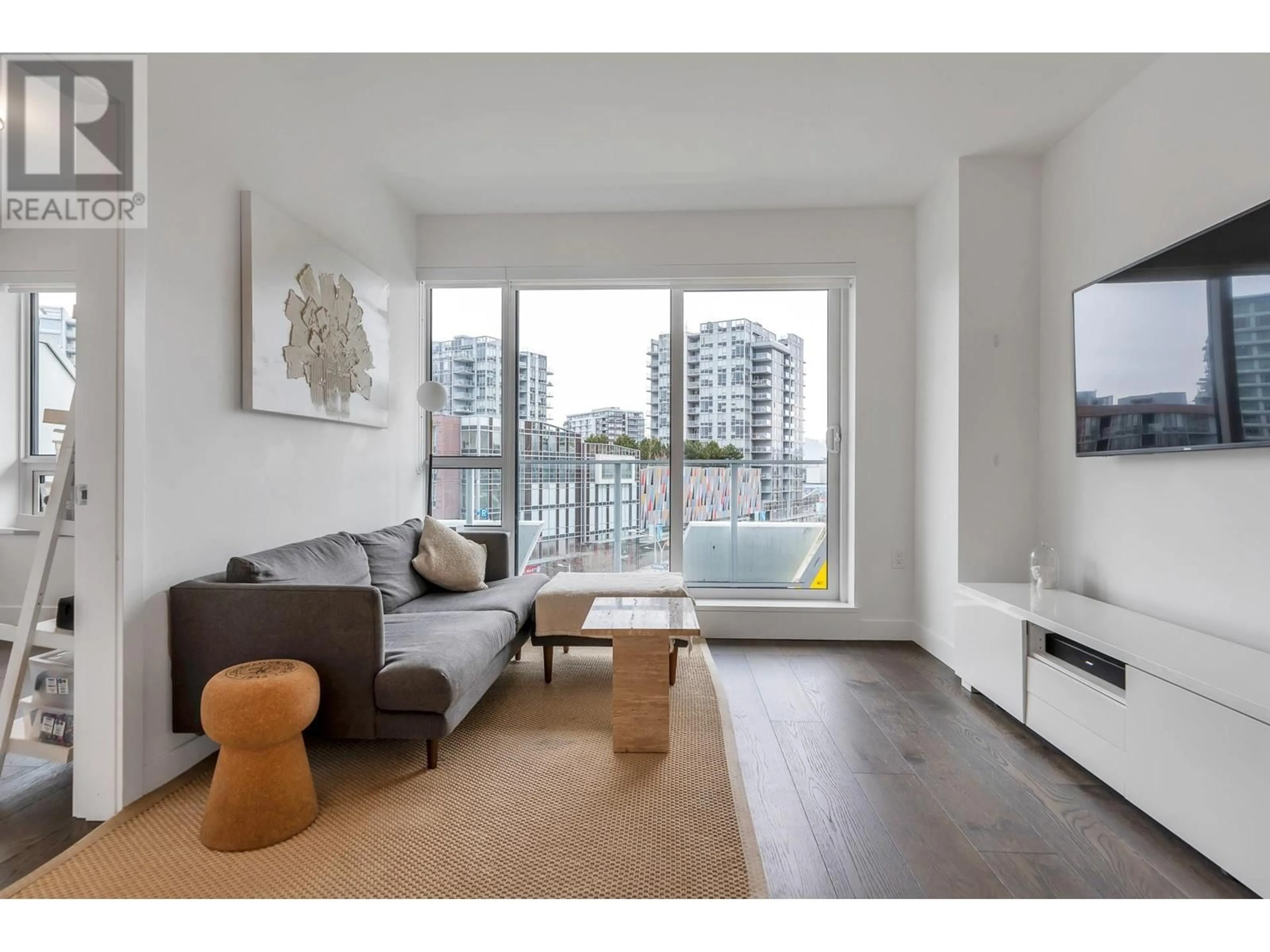 Living room with furniture, wood/laminate floor for 607 - 5766 GILBERT ROAD, Richmond British Columbia V7C0G2
