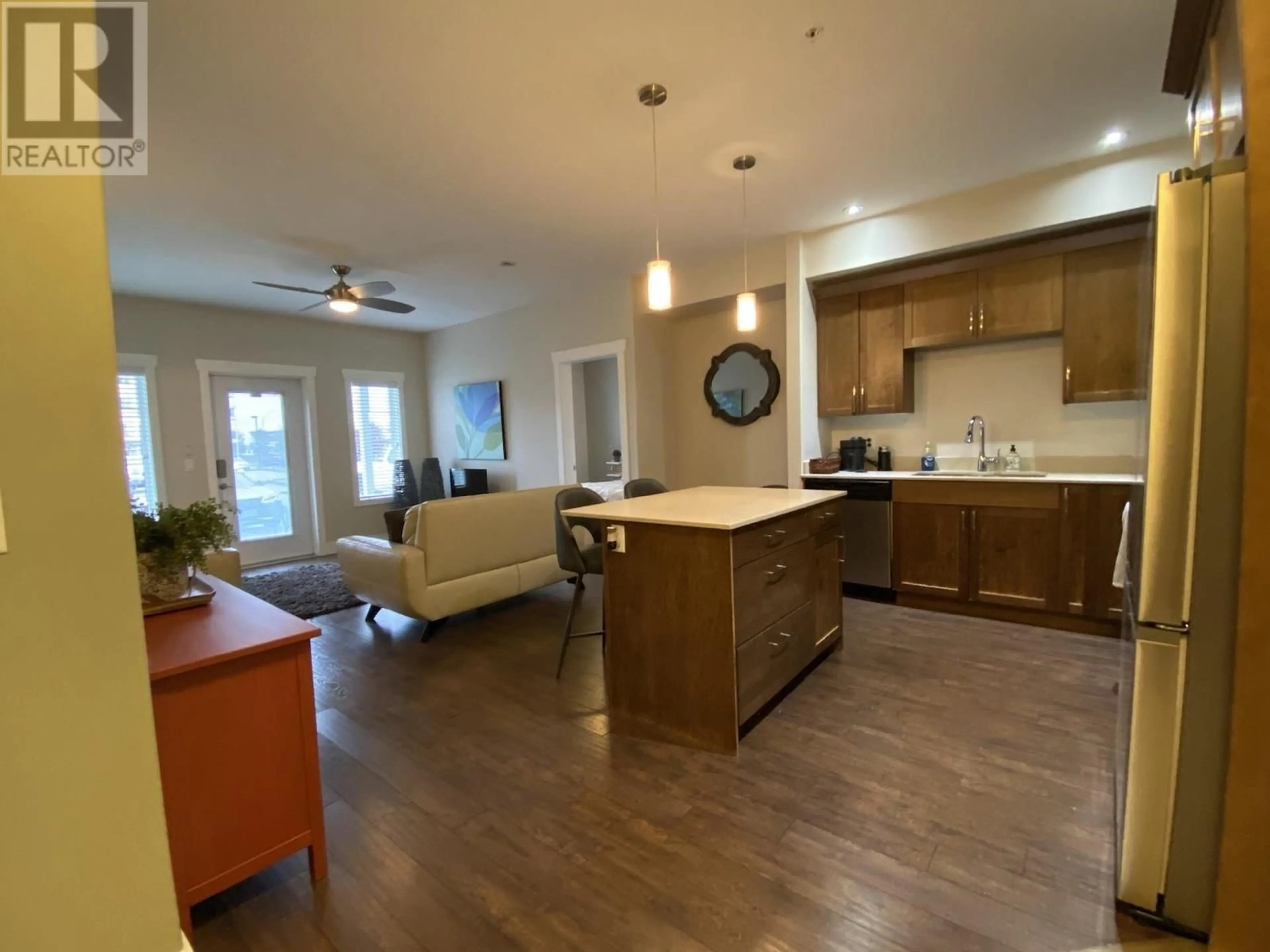 Open concept kitchen, wood/laminate floor for 112 - 11203 105 AVENUE, Fort St. John British Columbia V1J0L3