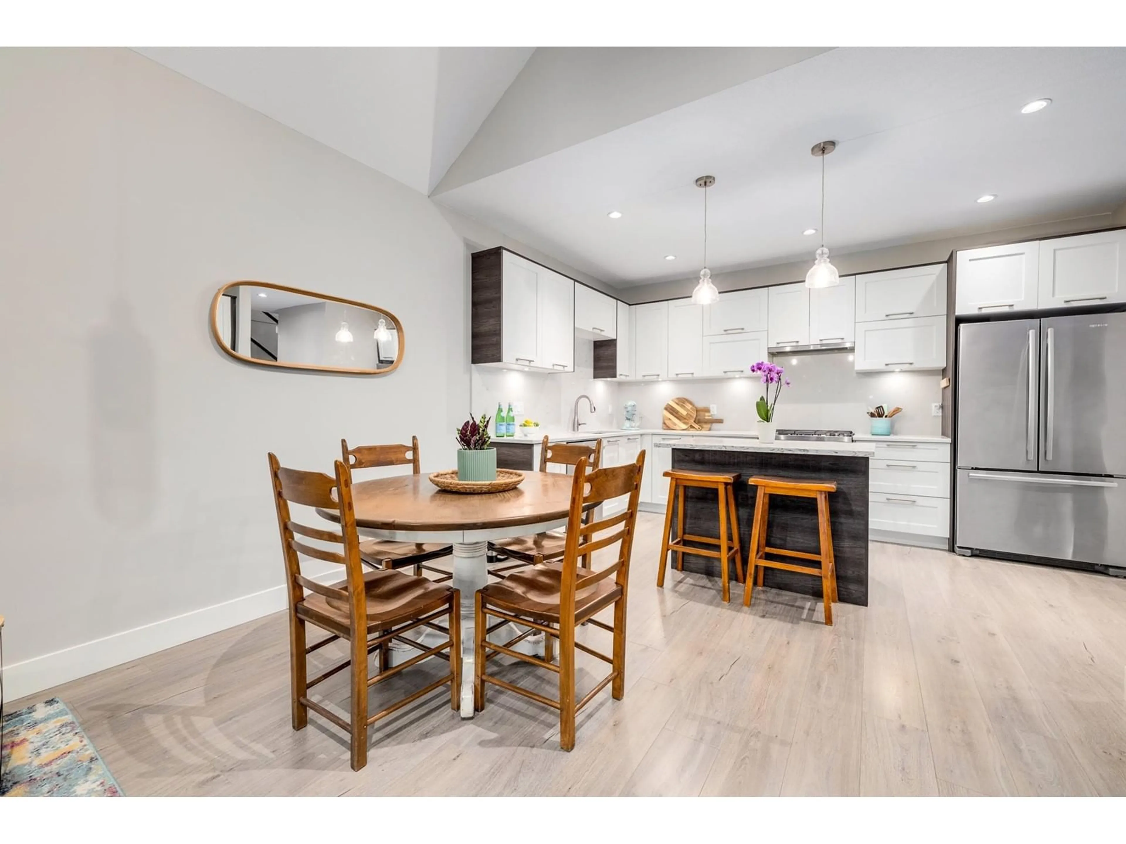 Open concept kitchen, wood/laminate floor for 111 - 2853 HELC, Surrey British Columbia V3Z0N5
