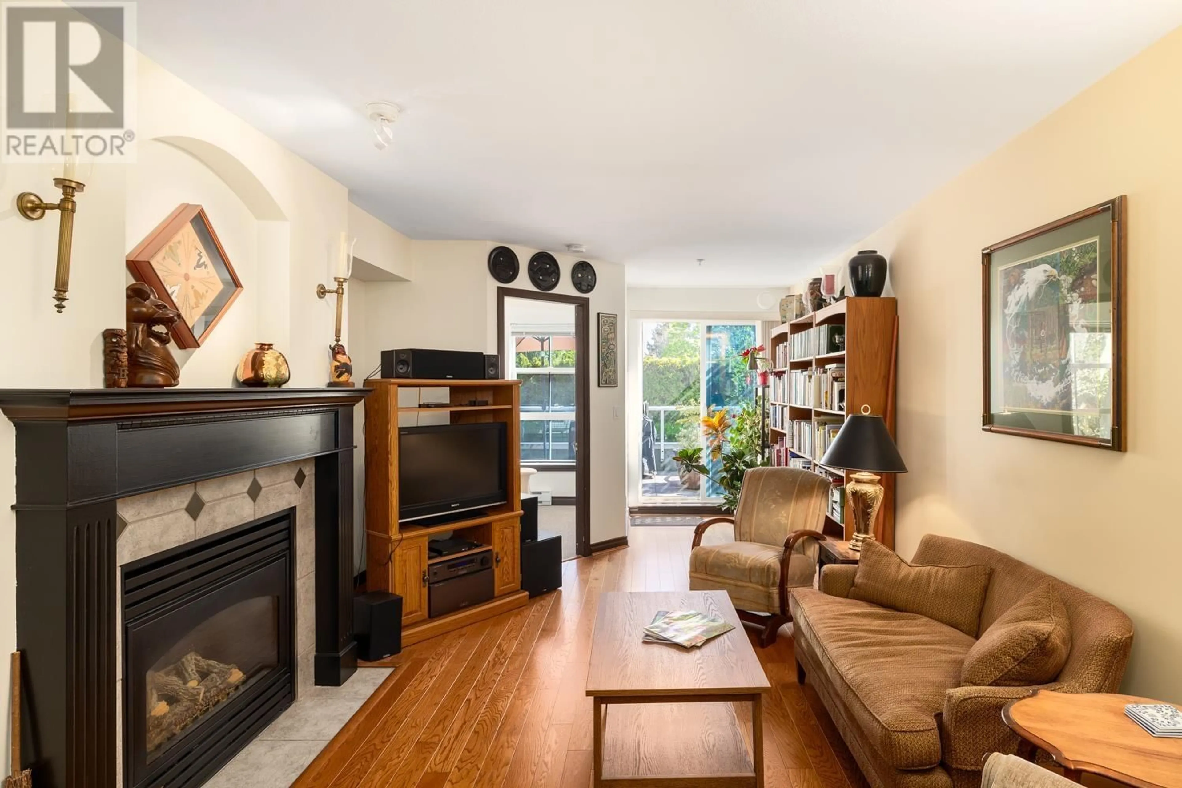 Living room with furniture, wood/laminate floor for 206 - 5723 COLLINGWOOD STREET, Vancouver British Columbia V6N4K6