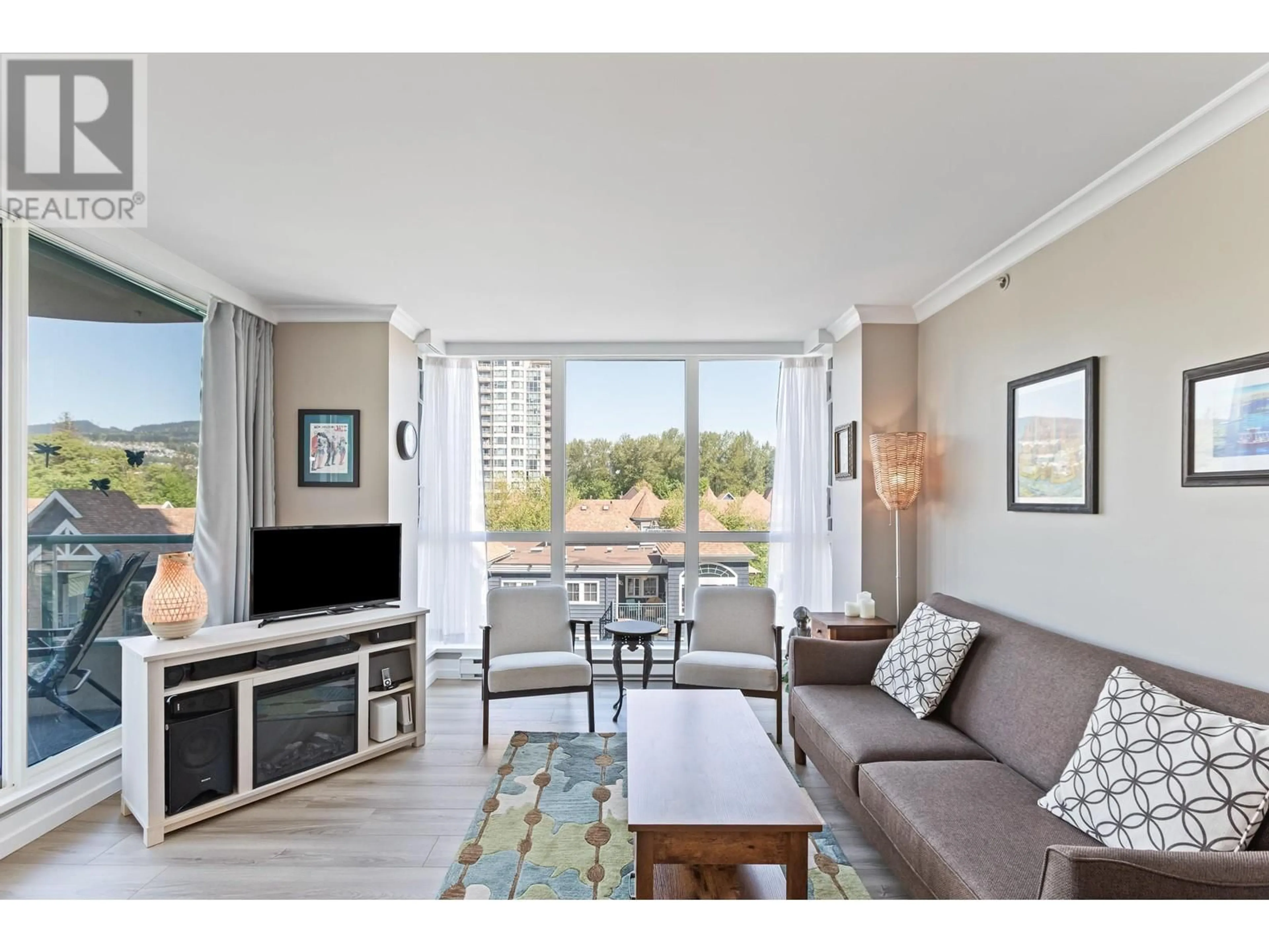 Living room with furniture, wood/laminate floor for 601 - 3071 GLEN DRIVE, Coquitlam British Columbia V3B7R1
