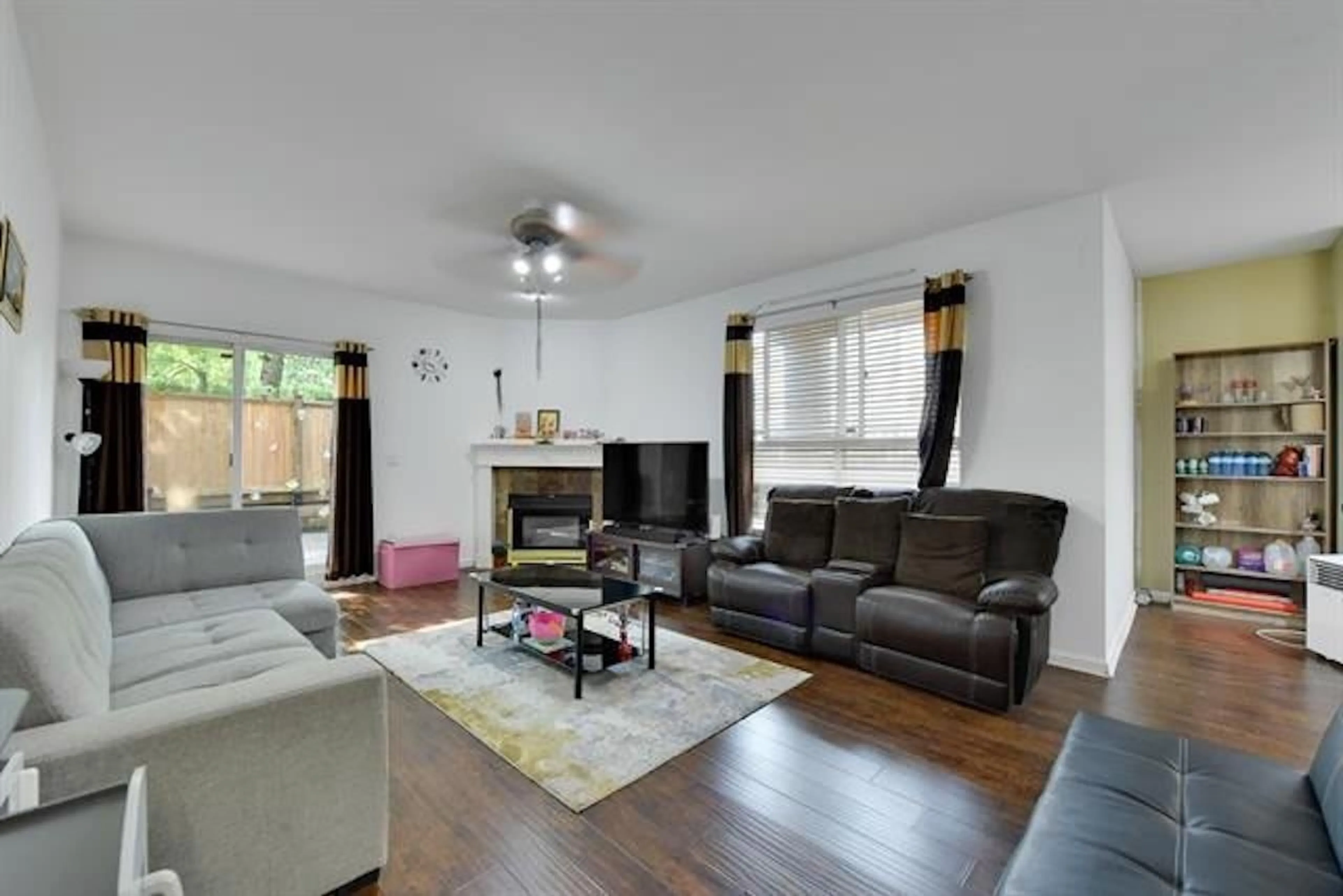 Living room with furniture, wood/laminate floor for 104 - 14993 101A, Surrey British Columbia V3R0T1