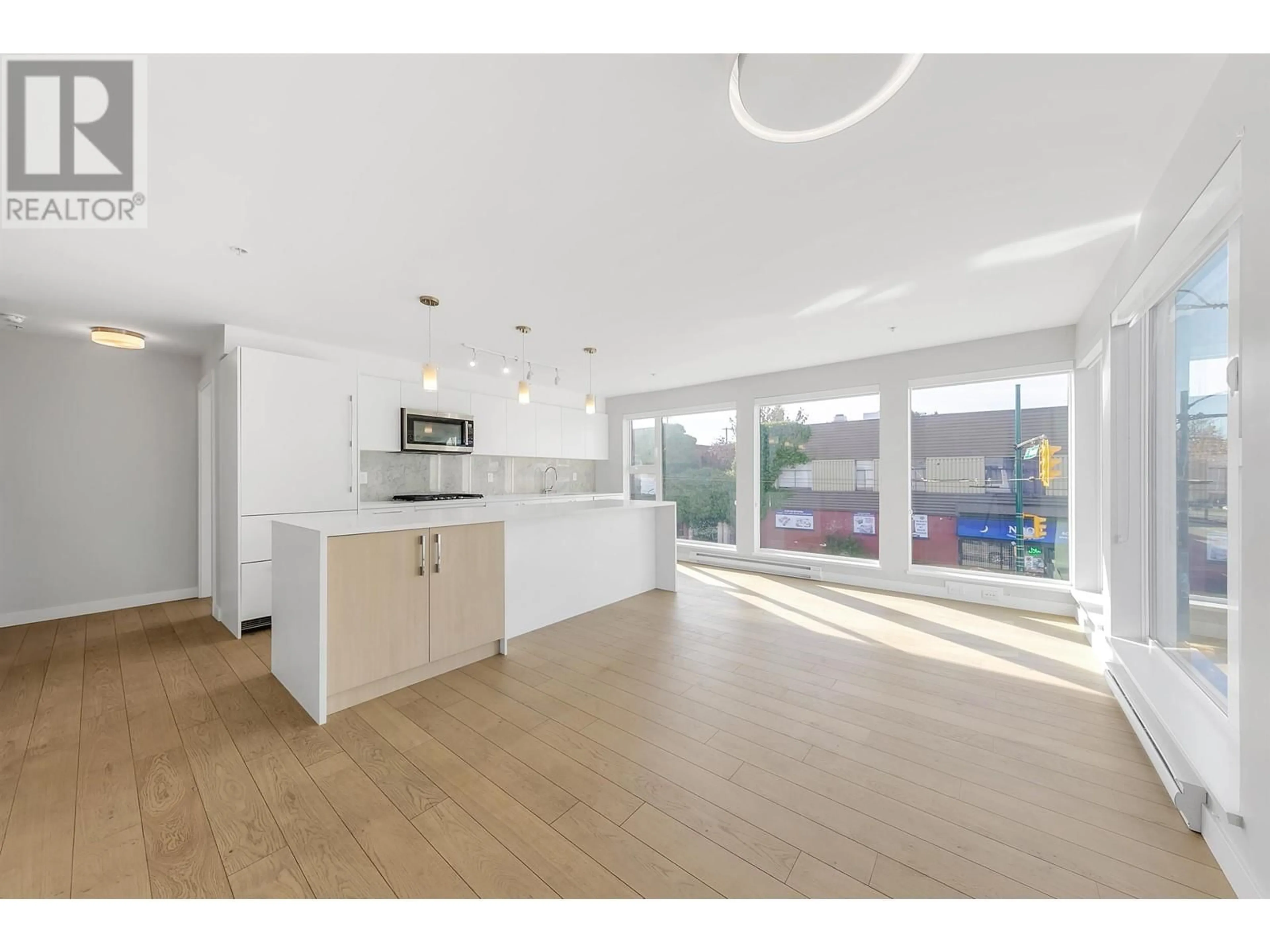 Open concept kitchen, unknown for 202 - 2508 FRASER STREET, Vancouver British Columbia V5T3V4