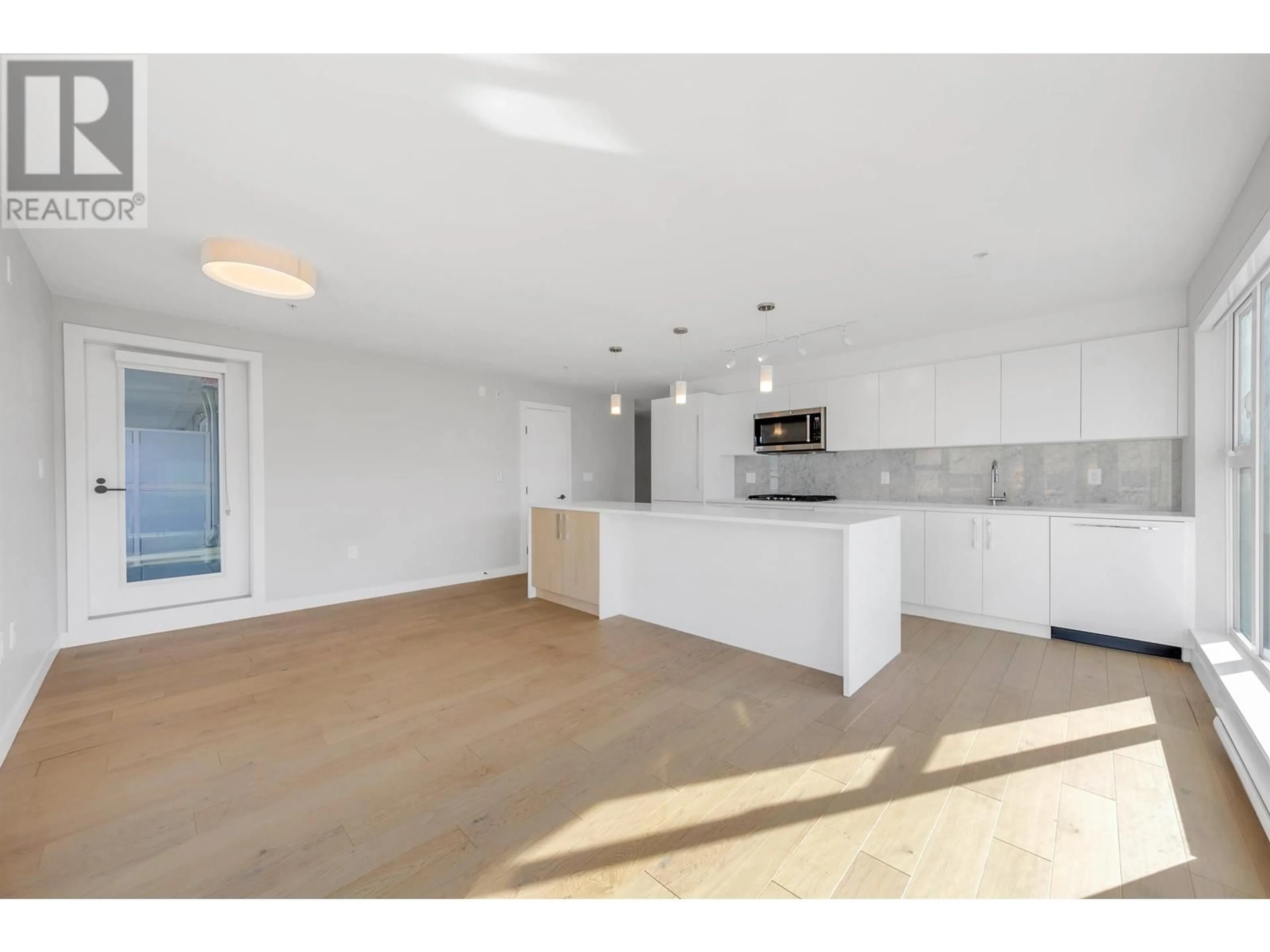Open concept kitchen, unknown for 202 - 2508 FRASER STREET, Vancouver British Columbia V5T3V4
