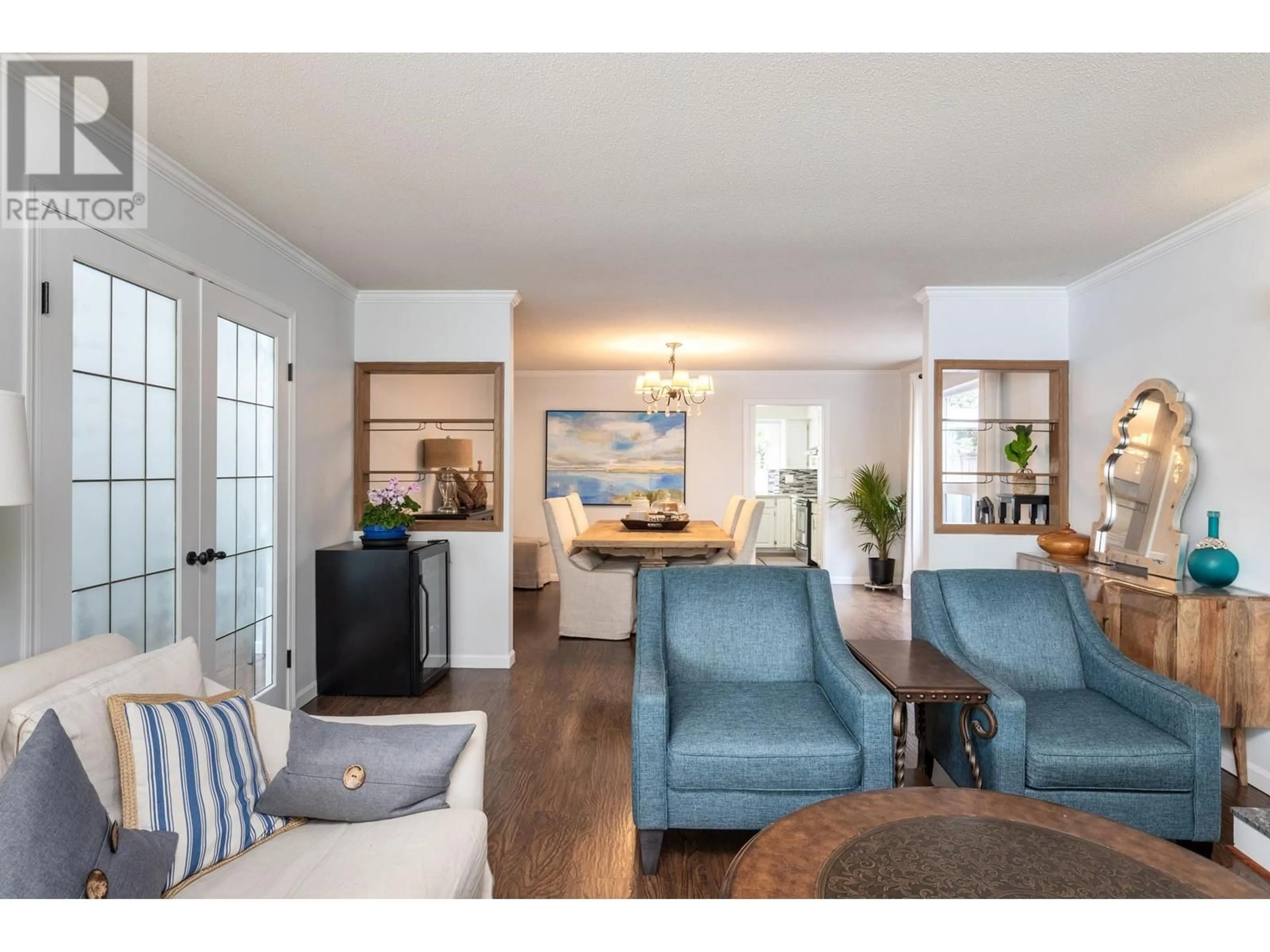 Living room with furniture, wood/laminate floor for 4431 50A STREET, Delta British Columbia V4K4M2