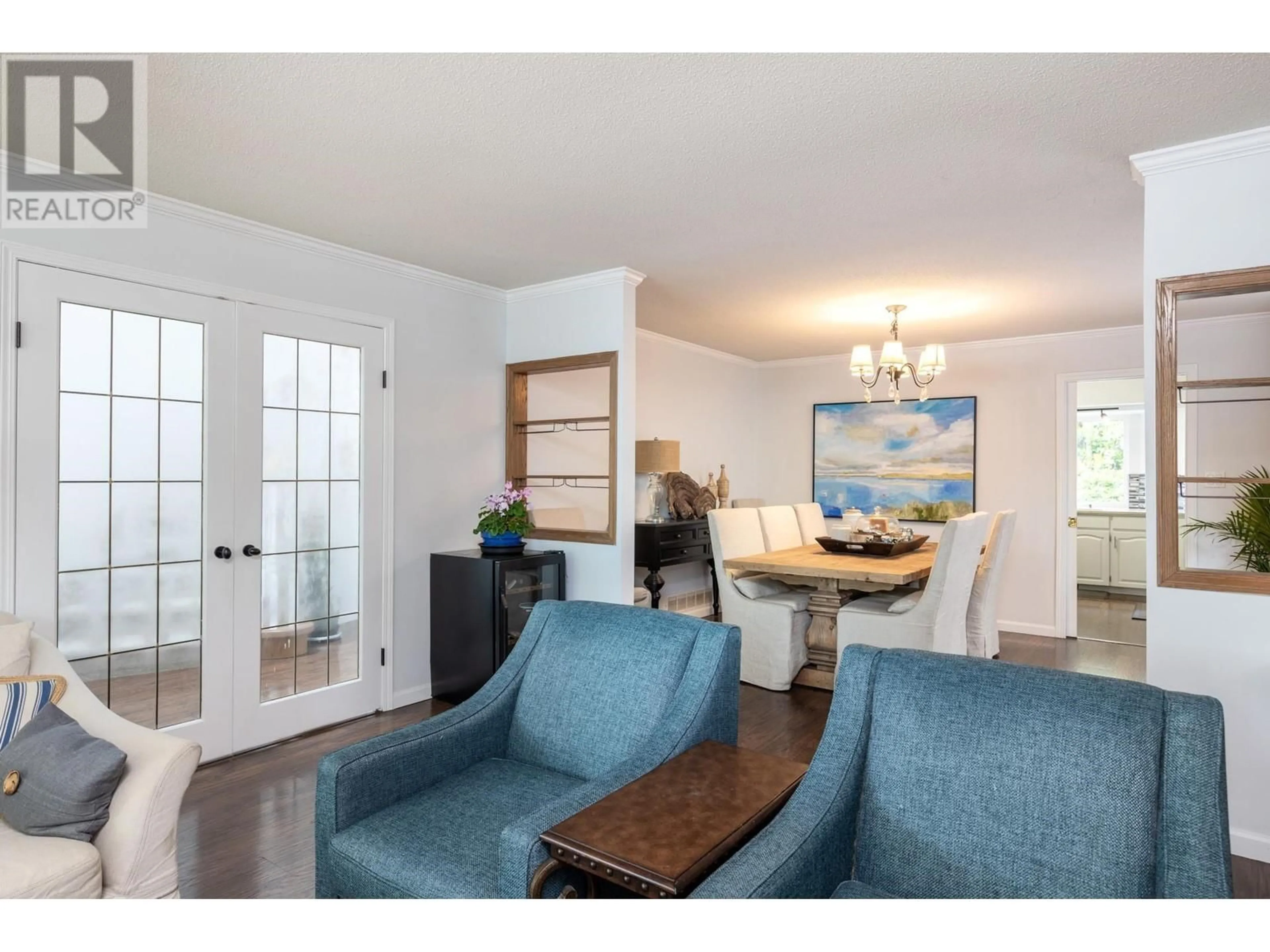 Living room with furniture, wood/laminate floor for 4431 50A STREET, Delta British Columbia V4K4M2