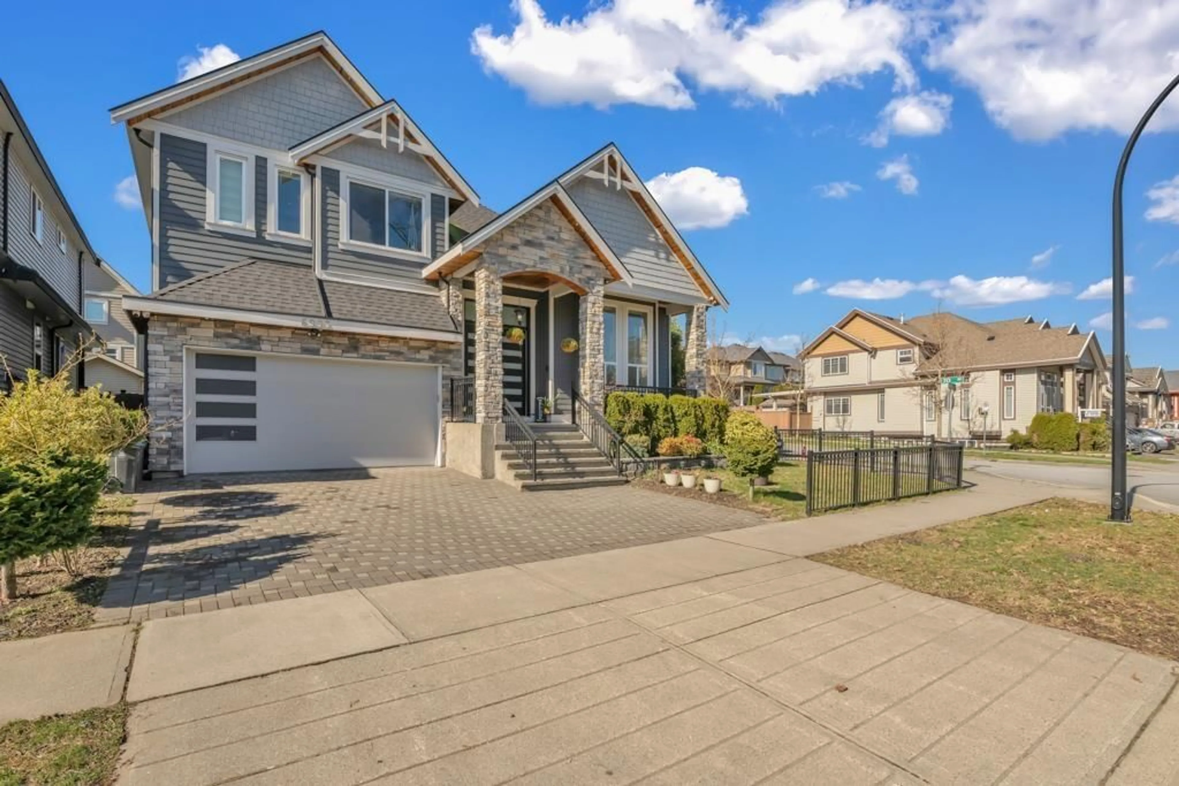 Home with vinyl exterior material, street for 6993 149A, Surrey British Columbia V3S1K2