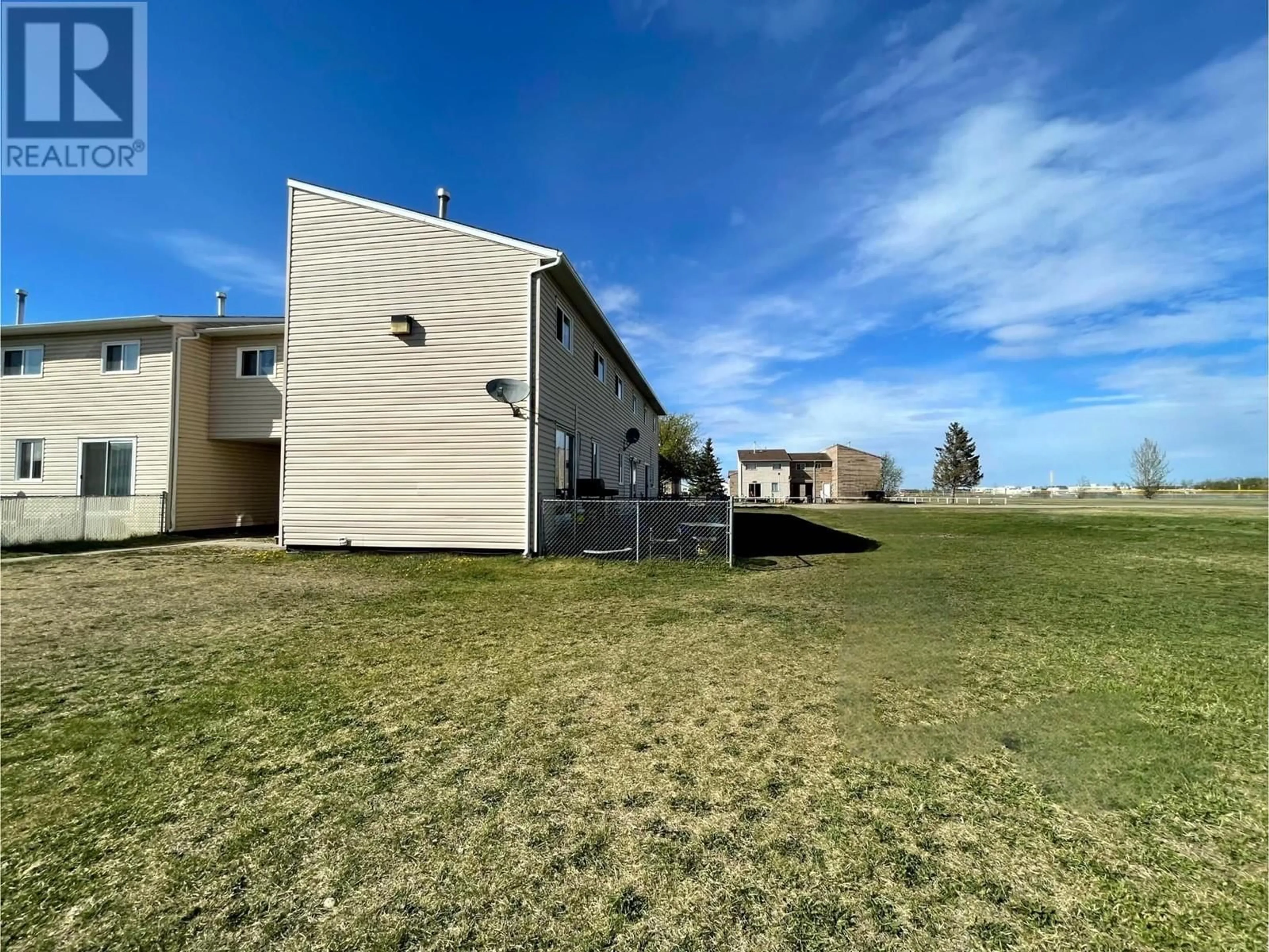 A pic from outside/outdoor area/front of a property/back of a property/a pic from drone, building for 8810 101 AVENUE, Fort St. John British Columbia V1J5G2