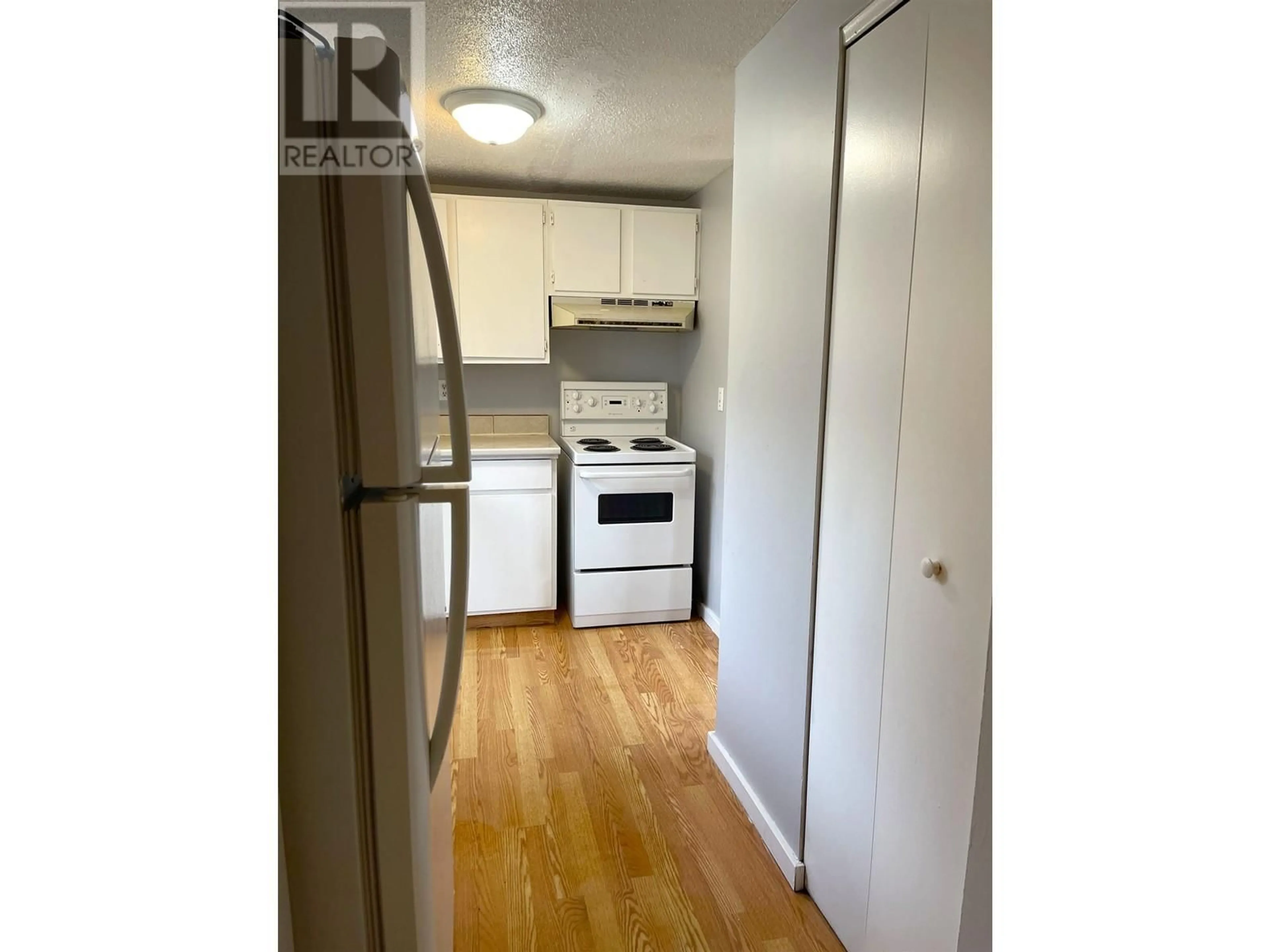 Standard kitchen, wood/laminate floor for 8810 101 AVENUE, Fort St. John British Columbia V1J5G2