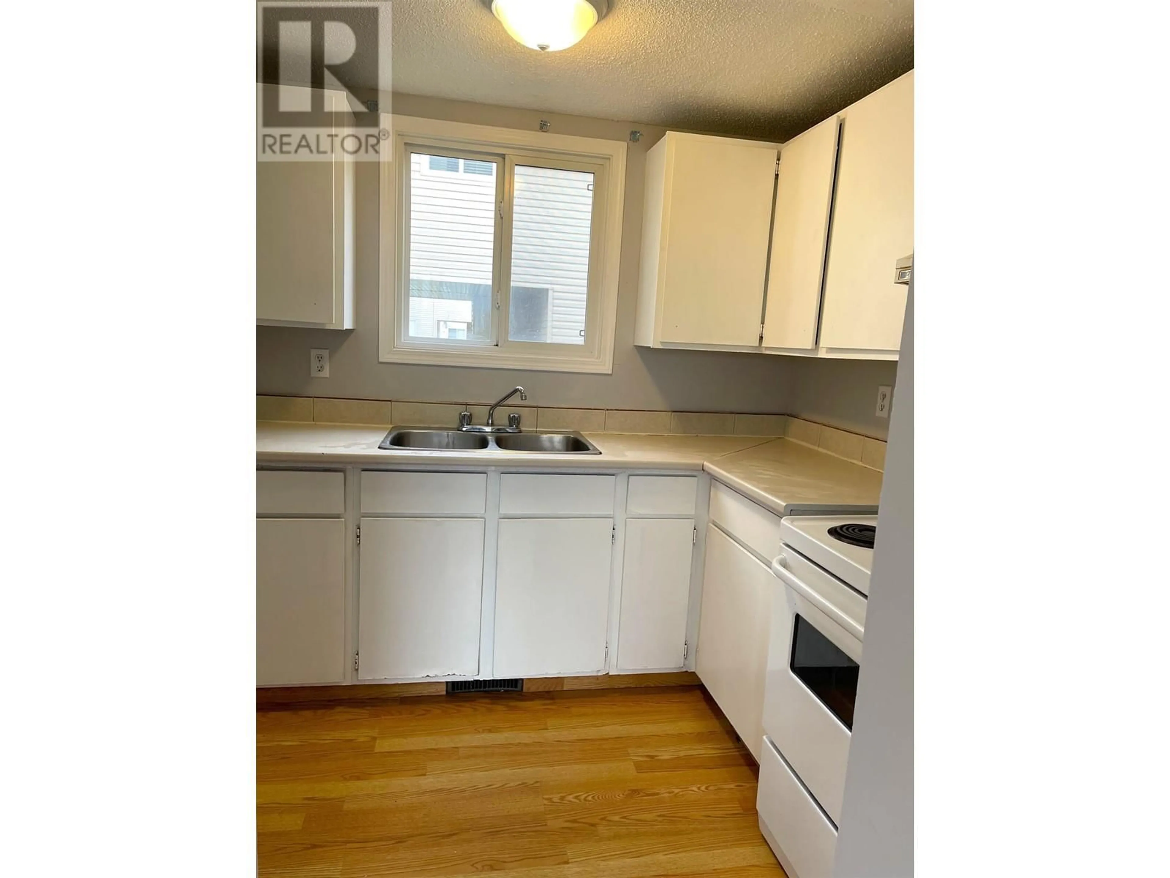 Standard kitchen, wood/laminate floor for 8810 101 AVENUE, Fort St. John British Columbia V1J5G2