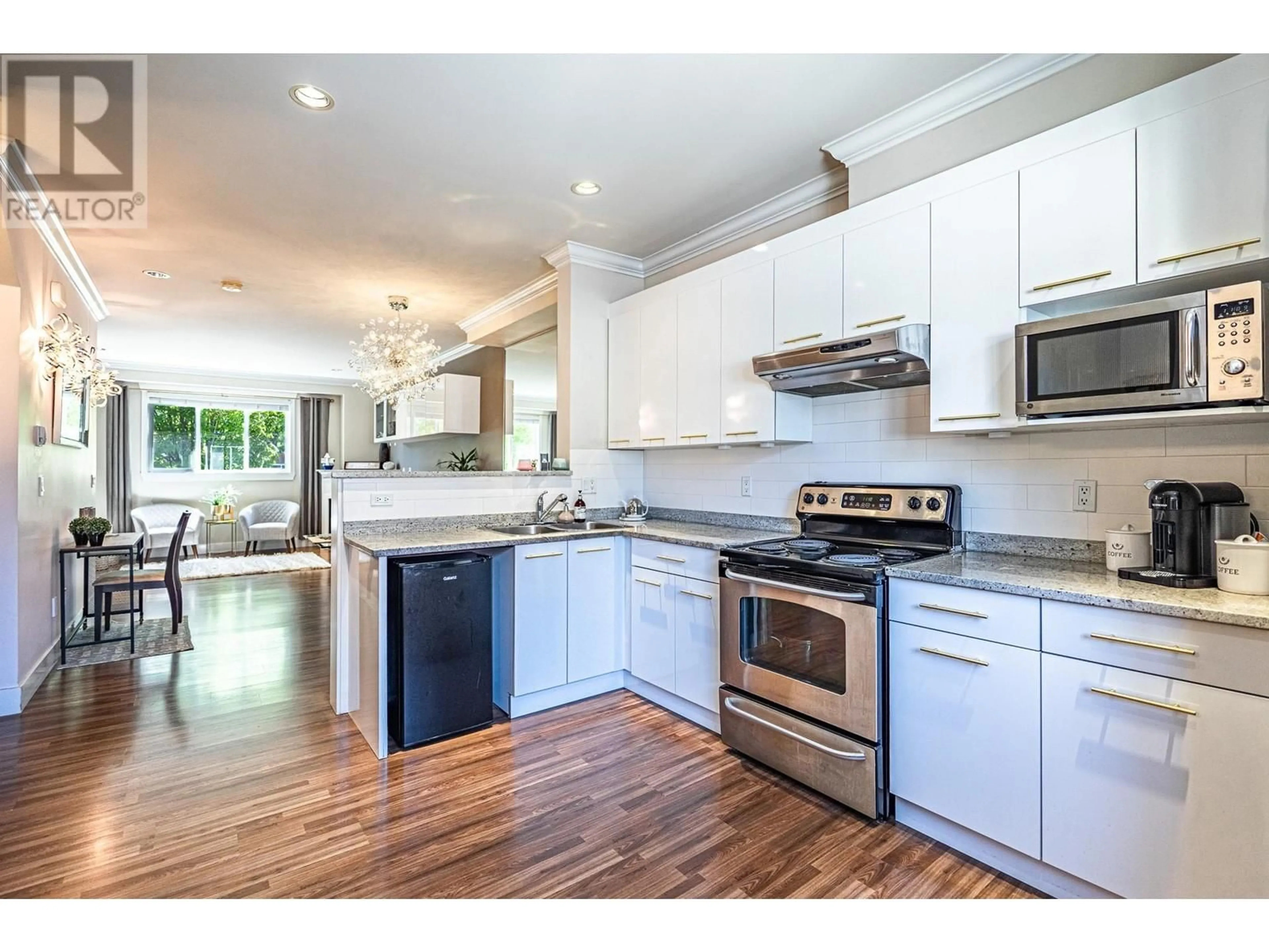 Open concept kitchen, wood/laminate floor for 2 - 6551 NO. 4 ROAD, Richmond British Columbia V6Y2T2