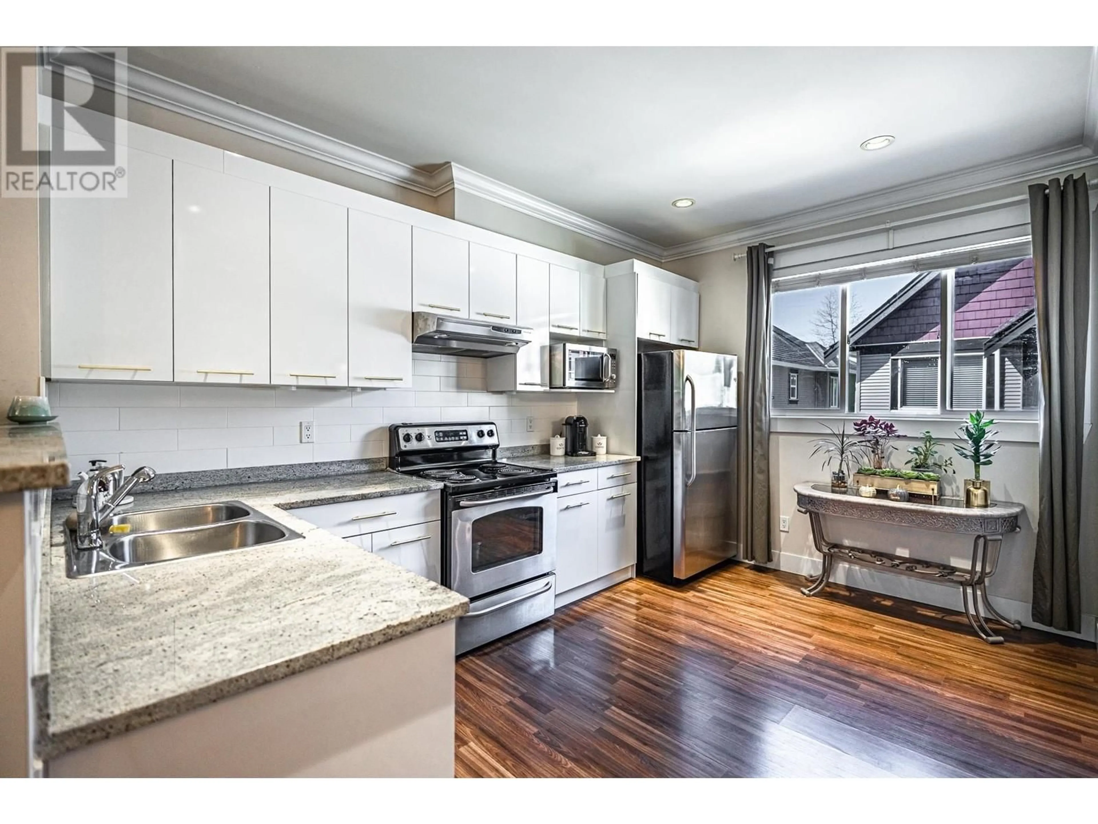 Open concept kitchen, wood/laminate floor for 2 - 6551 NO. 4 ROAD, Richmond British Columbia V6Y2T2