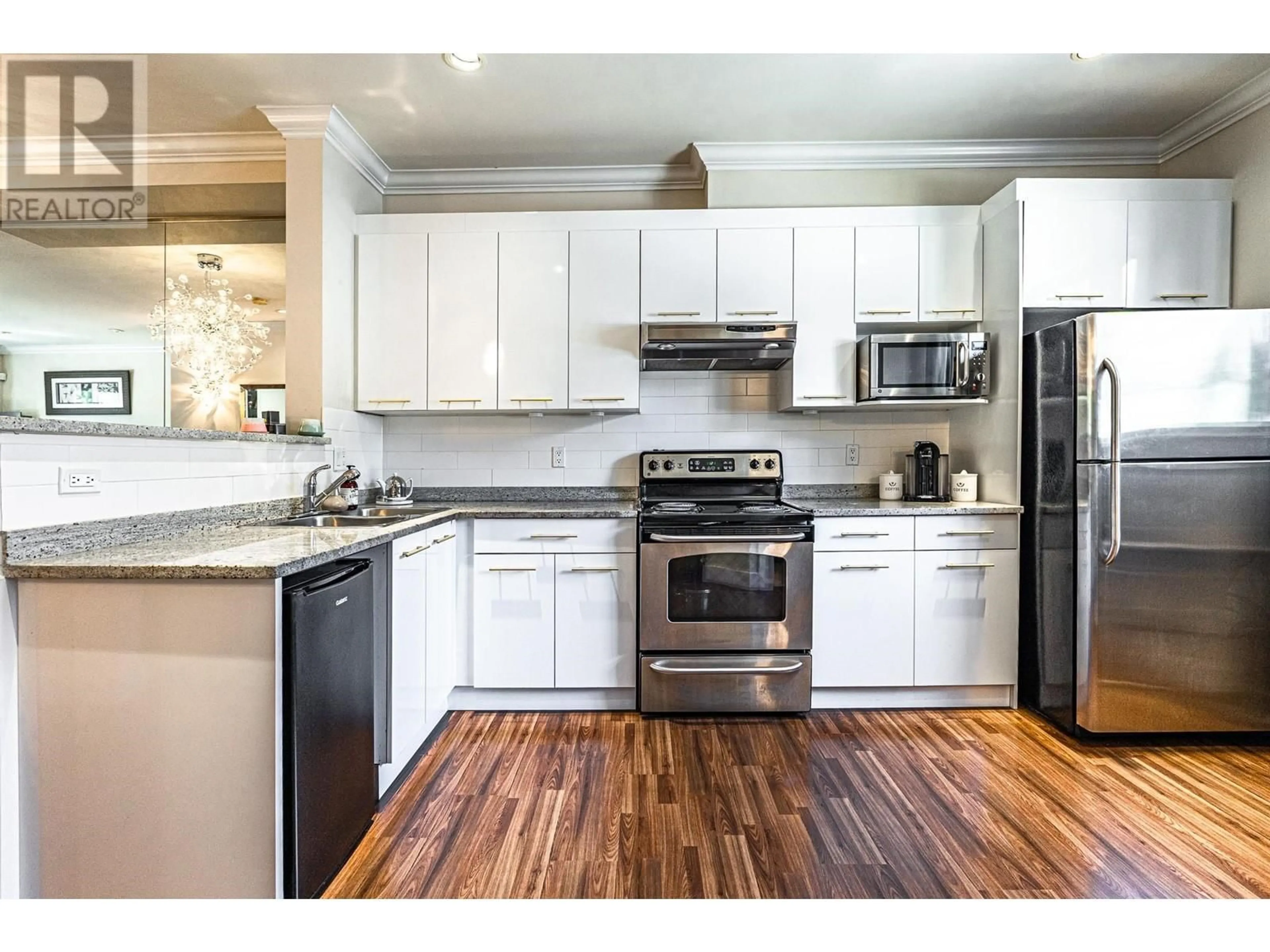Open concept kitchen, wood/laminate floor for 2 - 6551 NO. 4 ROAD, Richmond British Columbia V6Y2T2