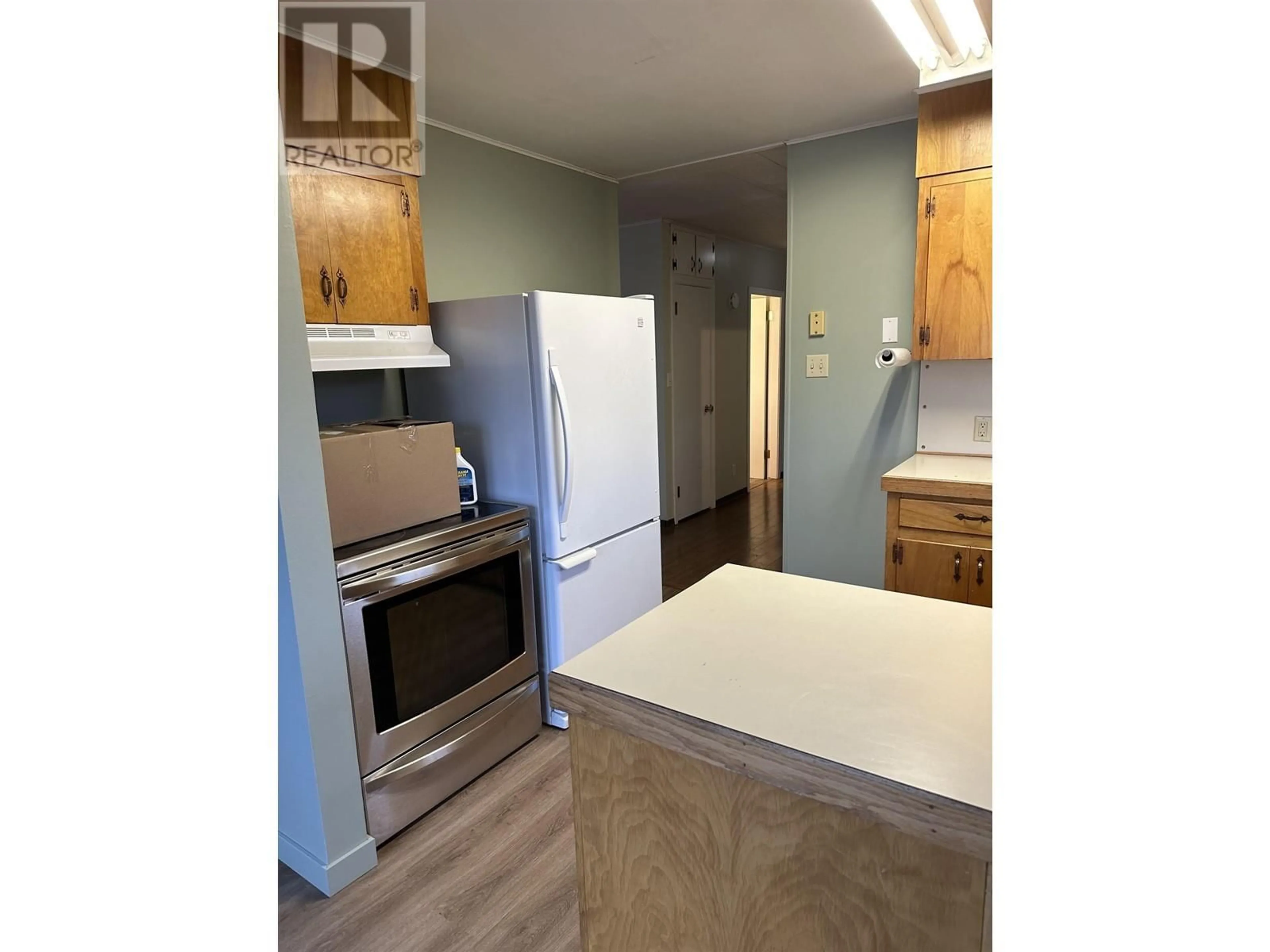 Standard kitchen, wood/laminate floor for 300 8TH AVENUE, Burns Lake British Columbia V0J1E0