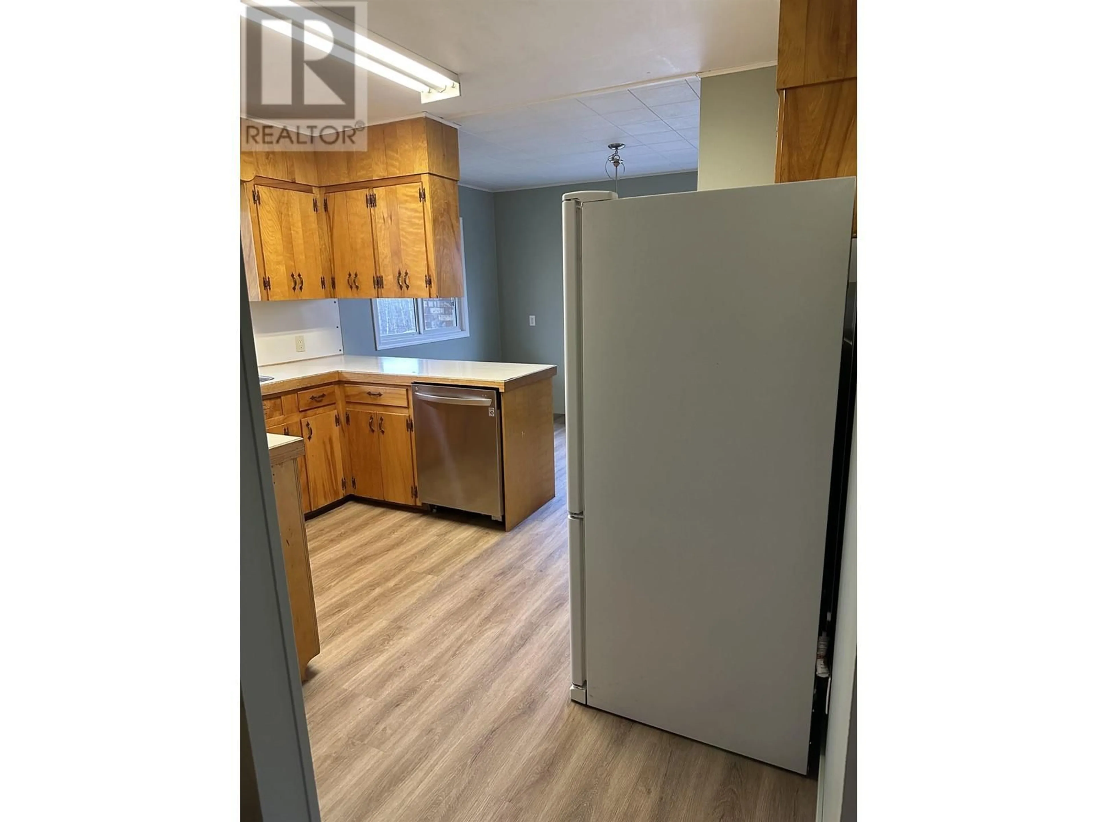 Standard kitchen, wood/laminate floor for 300 8TH AVENUE, Burns Lake British Columbia V0J1E0