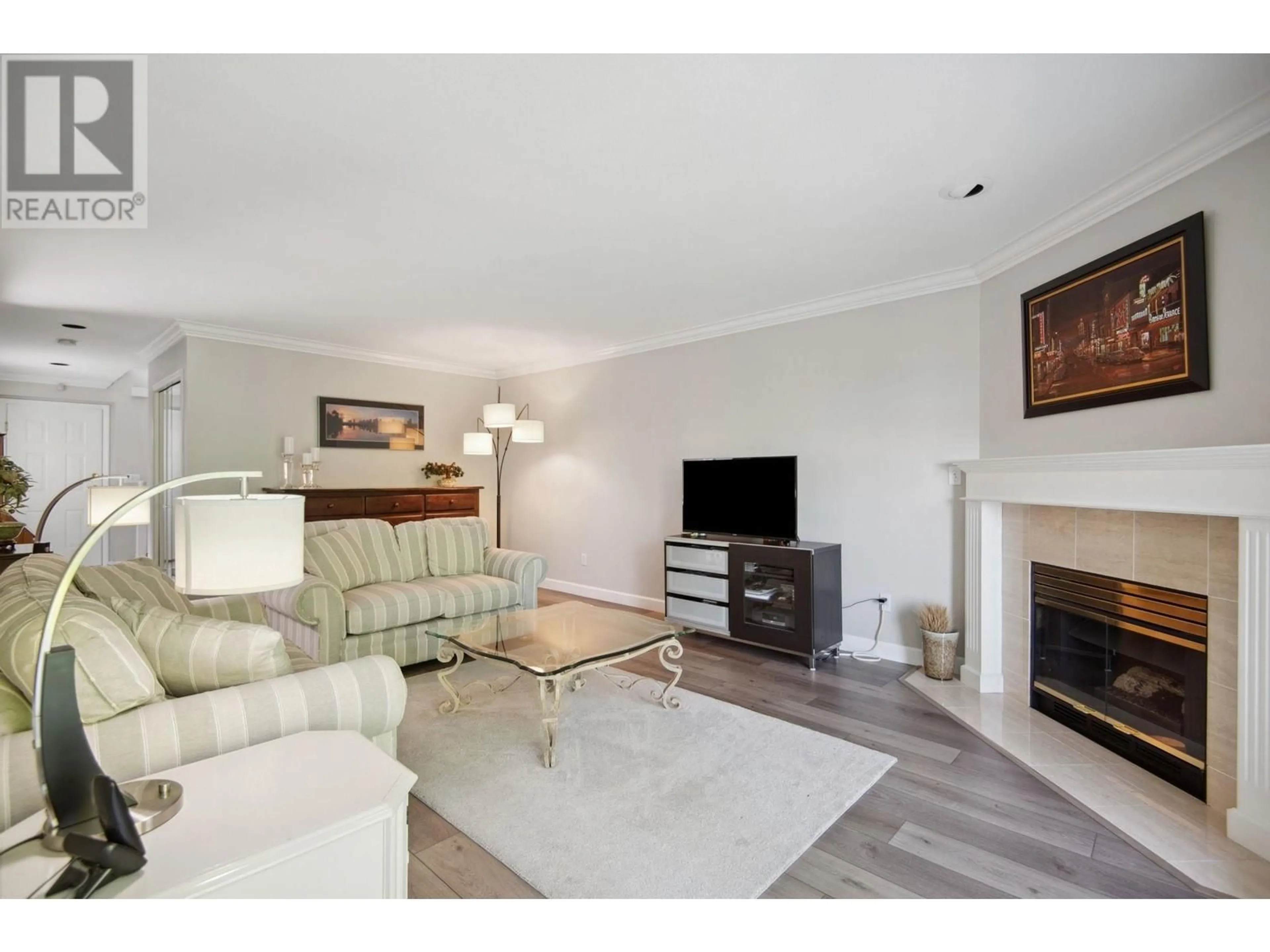 Living room with furniture, wood/laminate floor for 28 - 72 JAMIESON COURT, New Westminster British Columbia V3L5R6