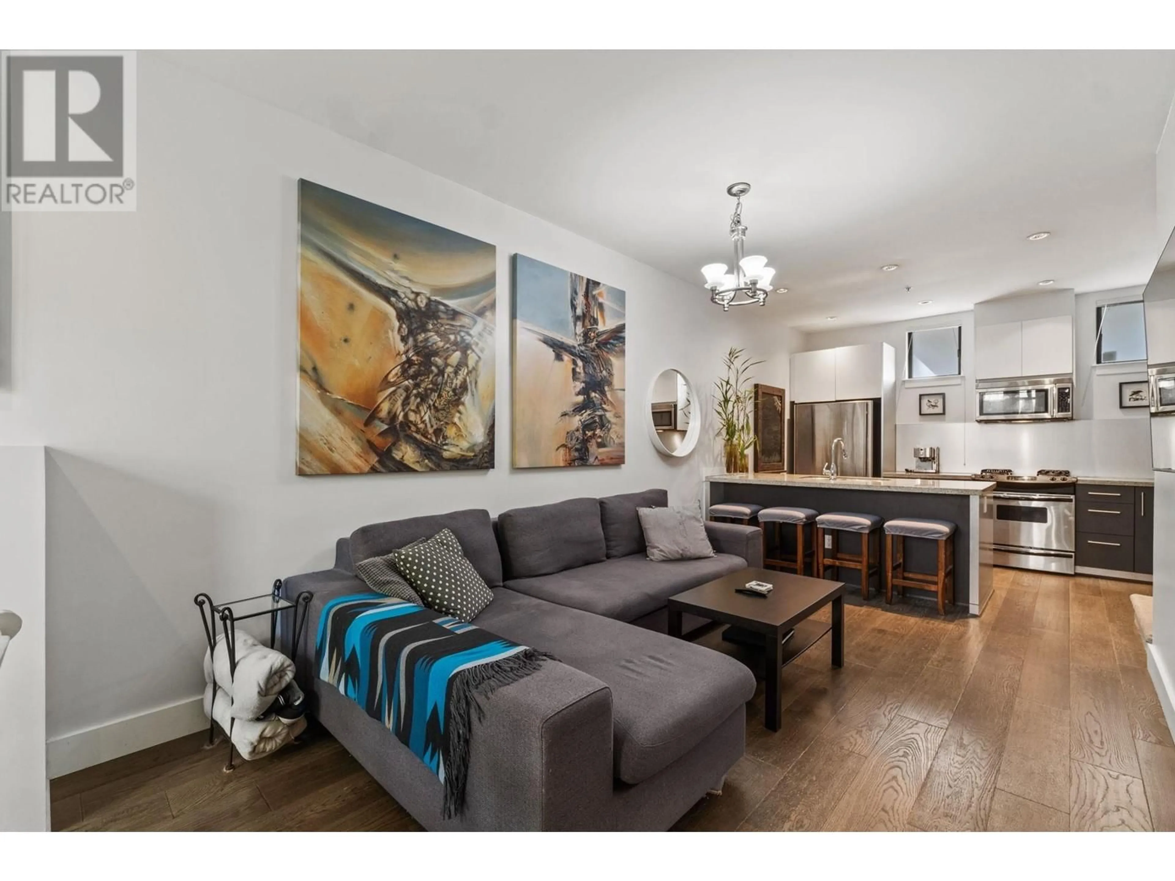 Living room with furniture, wood/laminate floor for 852 6TH AVENUE, Vancouver British Columbia V5Z1A6