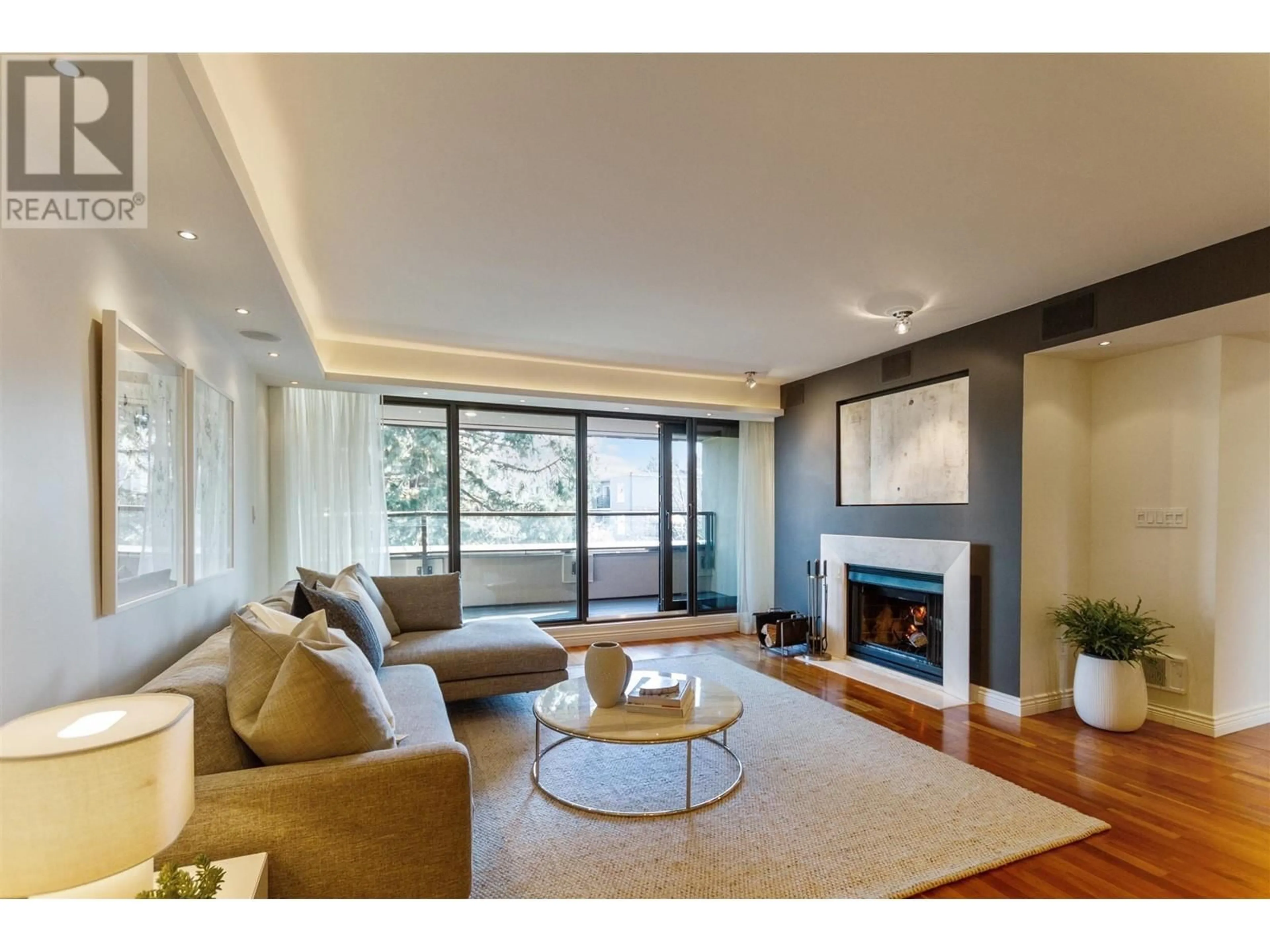 Living room with furniture, wood/laminate floor for 73 - 1425 LAMEY'S MILL ROAD, Vancouver British Columbia V6H3W2
