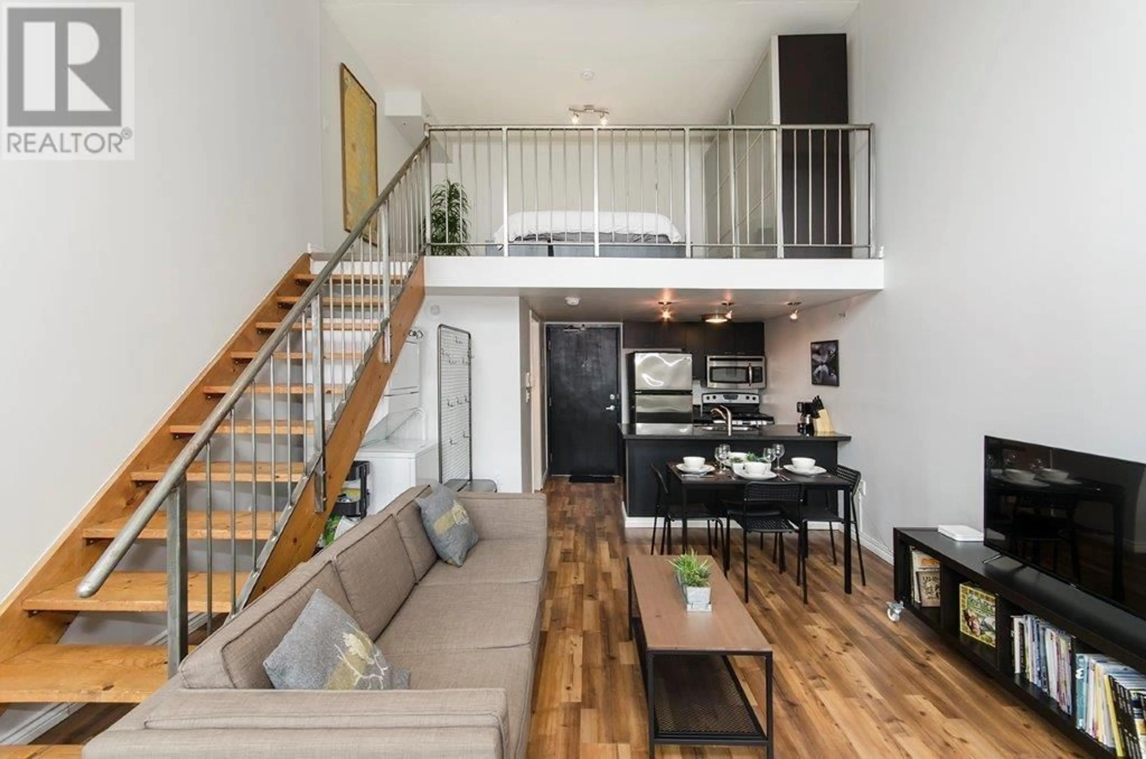 Living room with furniture, wood/laminate floor for 407 - 1 CORDOVA STREET, Vancouver British Columbia V6A4H3