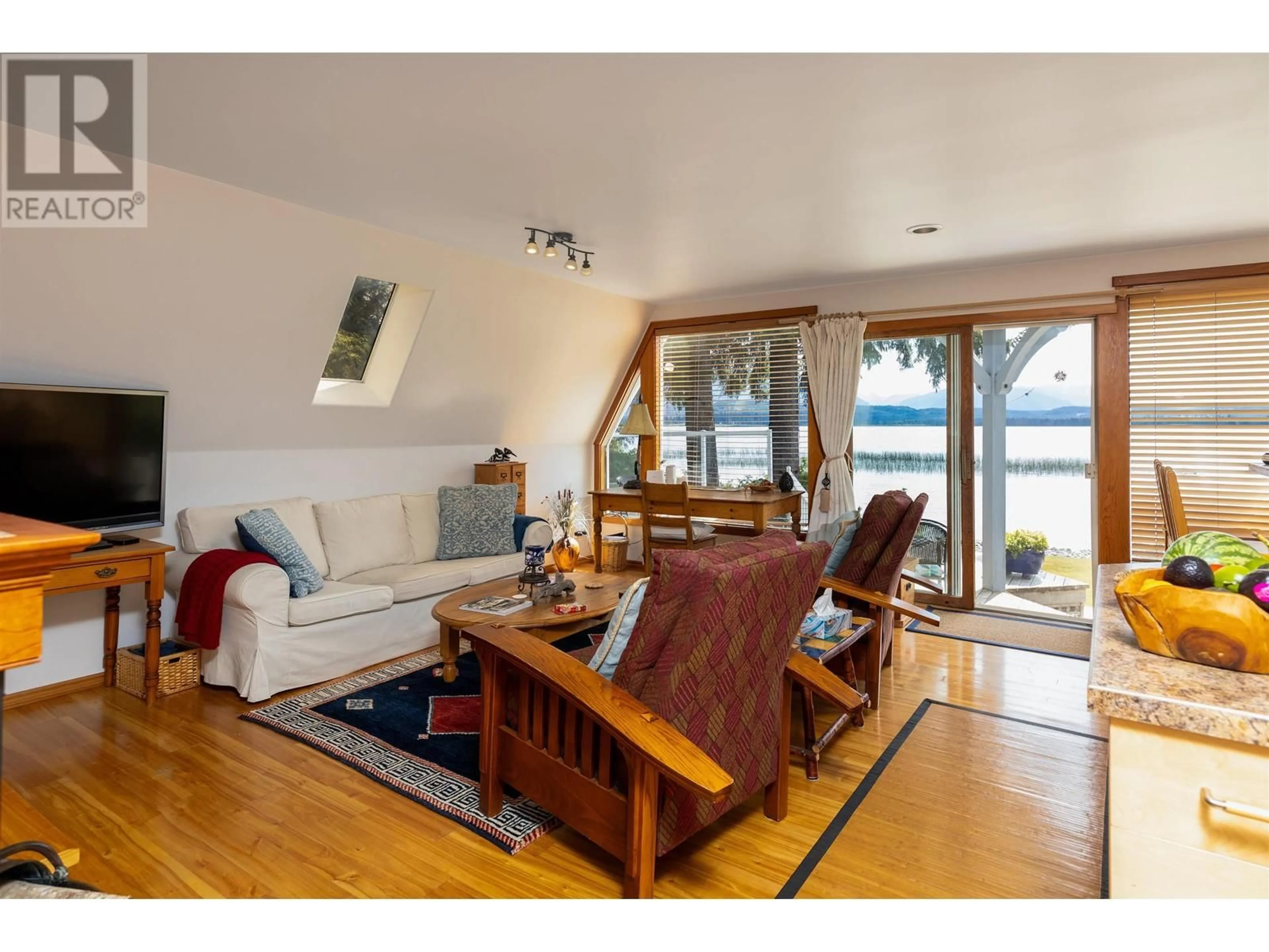 Living room with furniture, wood/laminate floor for 4685 LAKESIDE DRIVE, Terrace British Columbia V8G1T1
