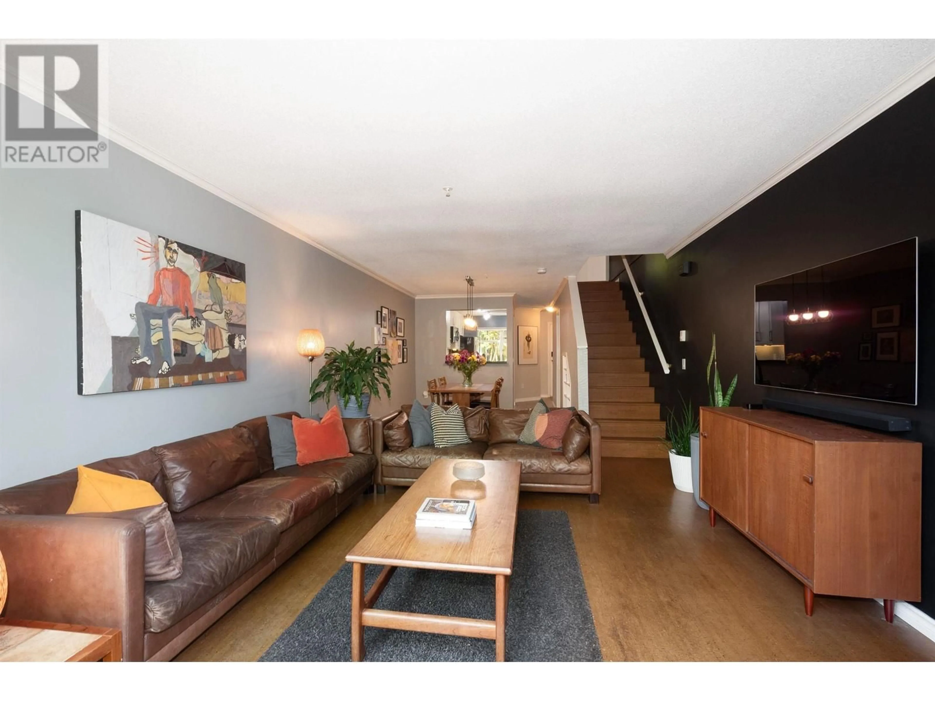 Living room with furniture, wood/laminate floor for 33 - 3439 TERRA VITA PLACE, Vancouver British Columbia V5K5H7