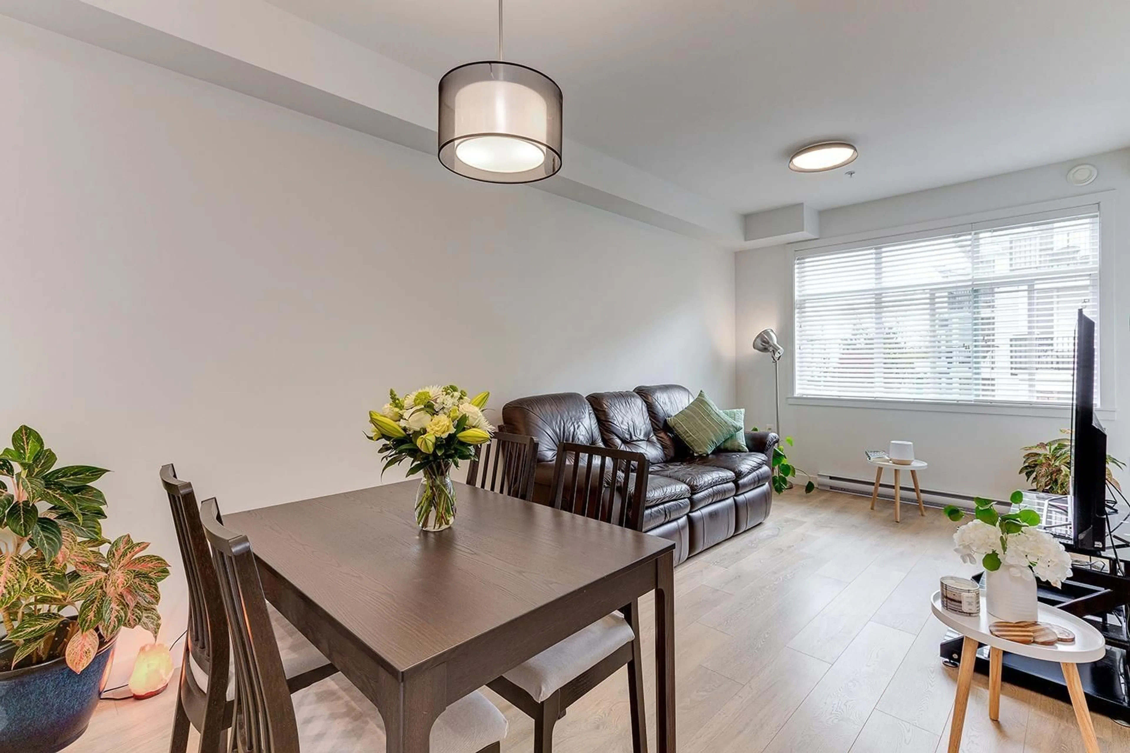 Living room with furniture, wood/laminate floor for 302 - 5415 BRYDON, Langley British Columbia V3A0N4