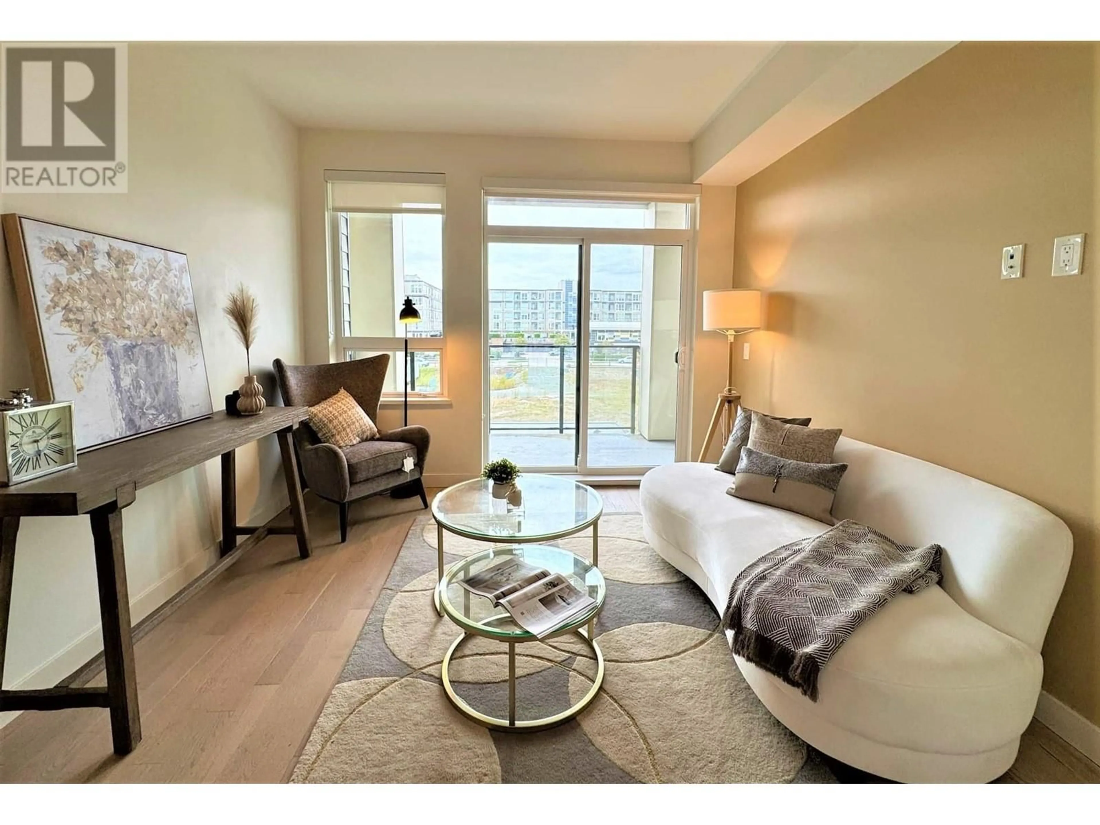 Living room with furniture, wood/laminate floor for 321 - 4033 MAY DRIVE, Richmond British Columbia V6X0T3