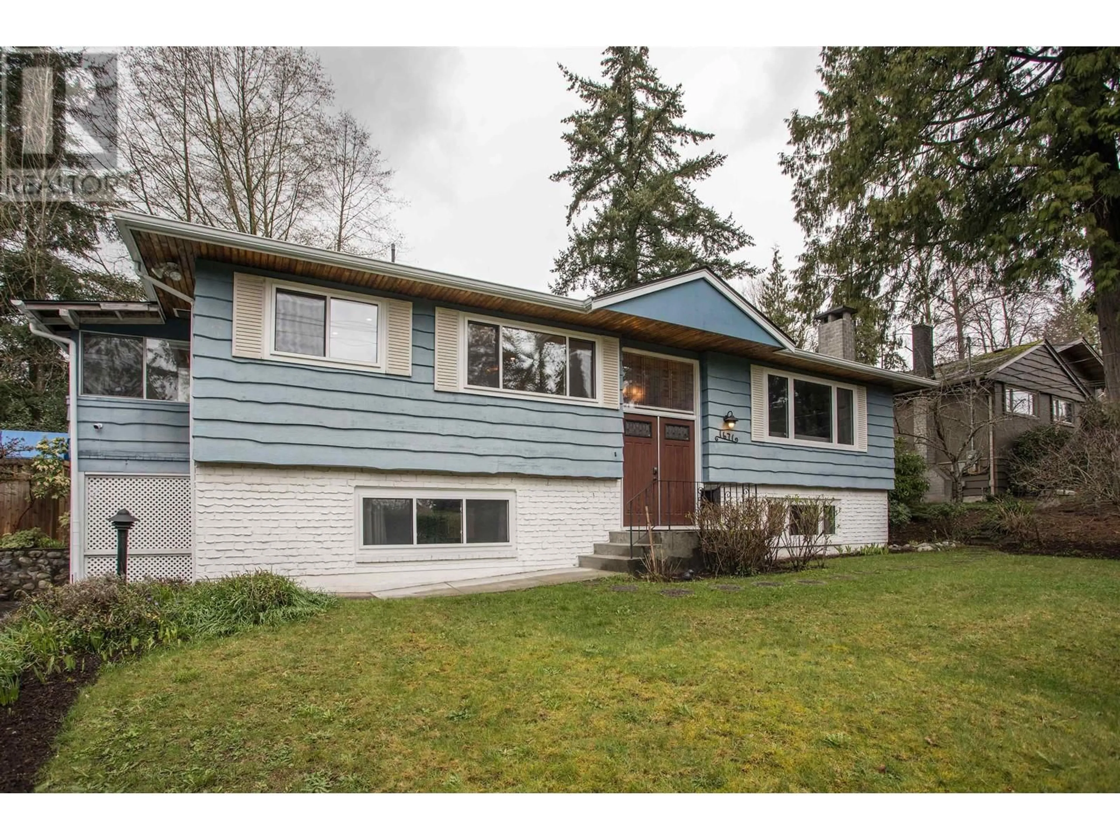 Home with vinyl exterior material, street for 1671 MOUNTAIN HIGHWAY, North Vancouver British Columbia V7J2M6