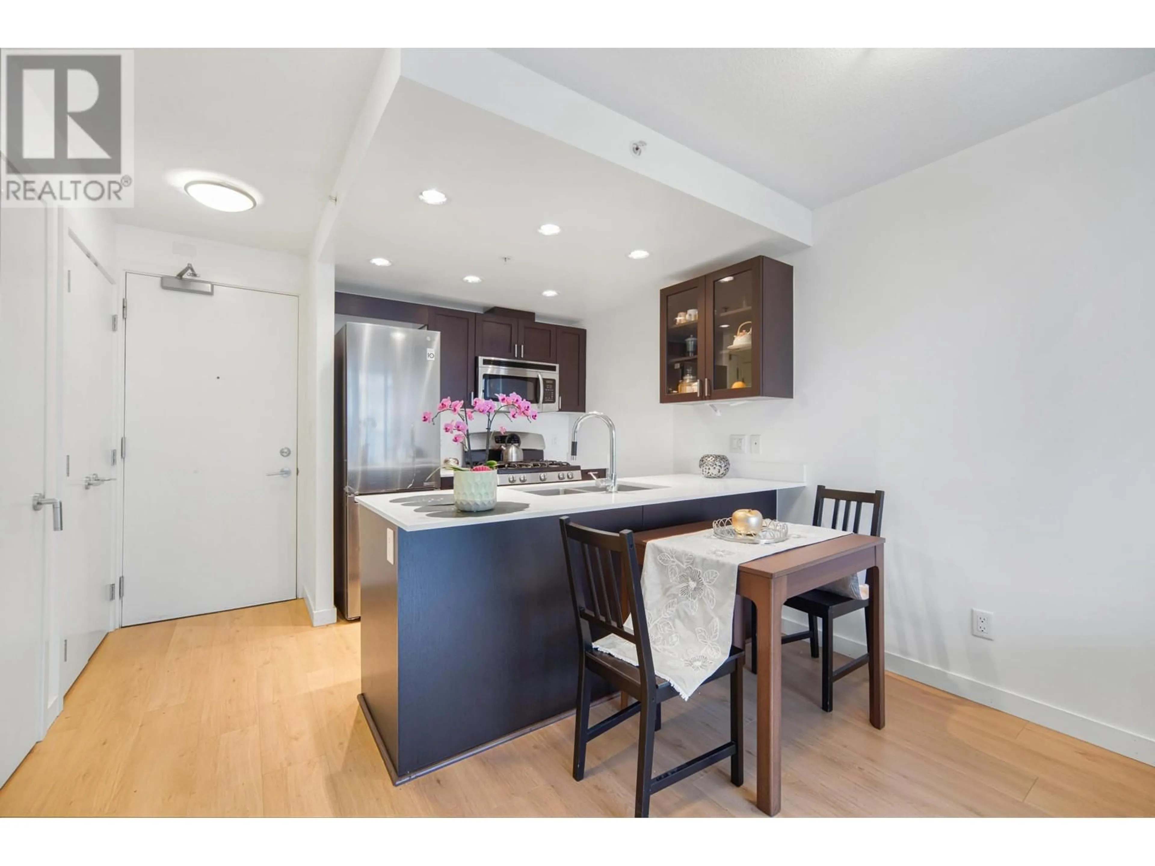 Open concept kitchen, wood/laminate floor for 608 - 4815 ELDORADO MEWS, Vancouver British Columbia V5R0B2