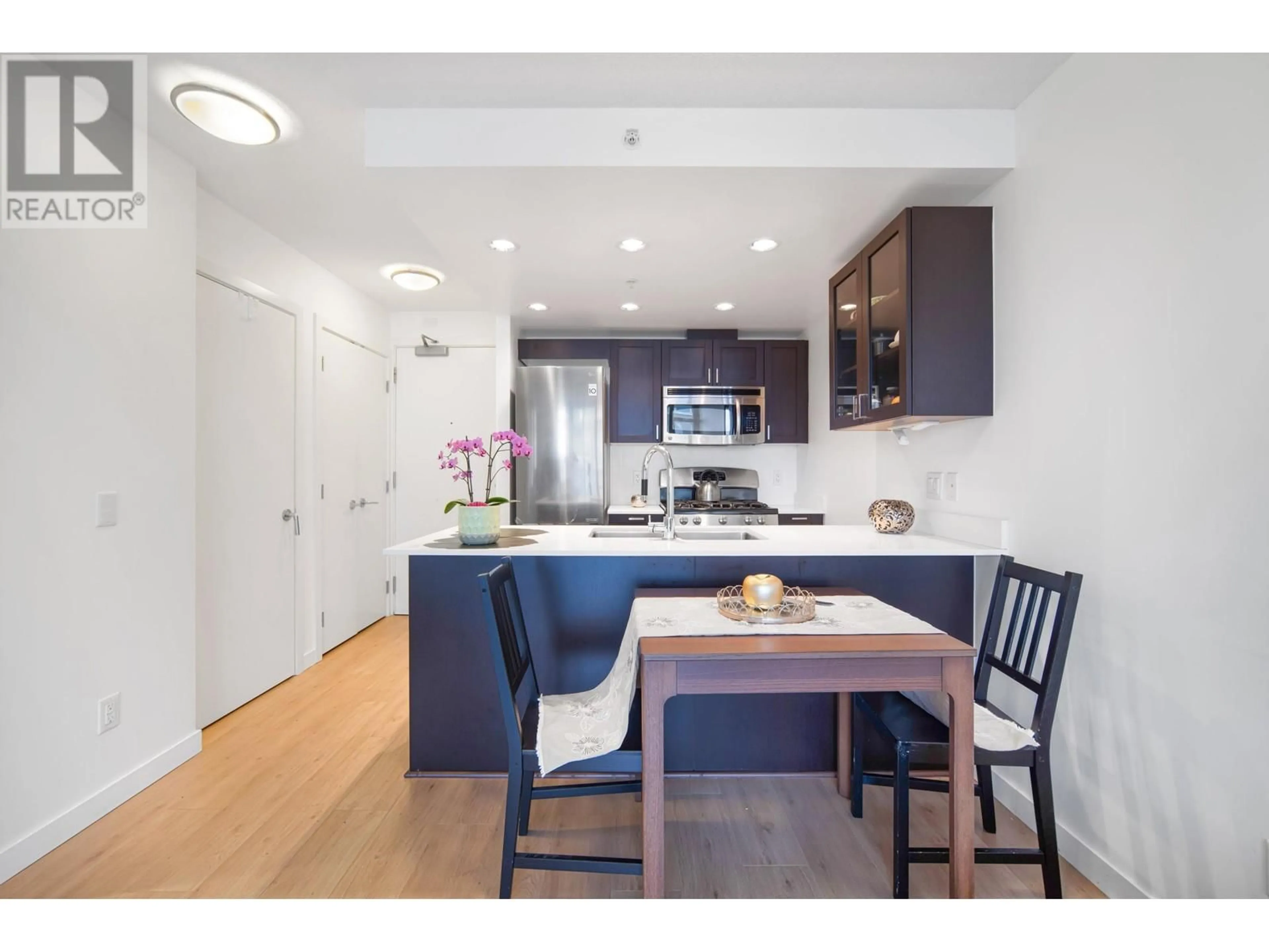 Open concept kitchen, wood/laminate floor for 608 - 4815 ELDORADO MEWS, Vancouver British Columbia V5R0B2