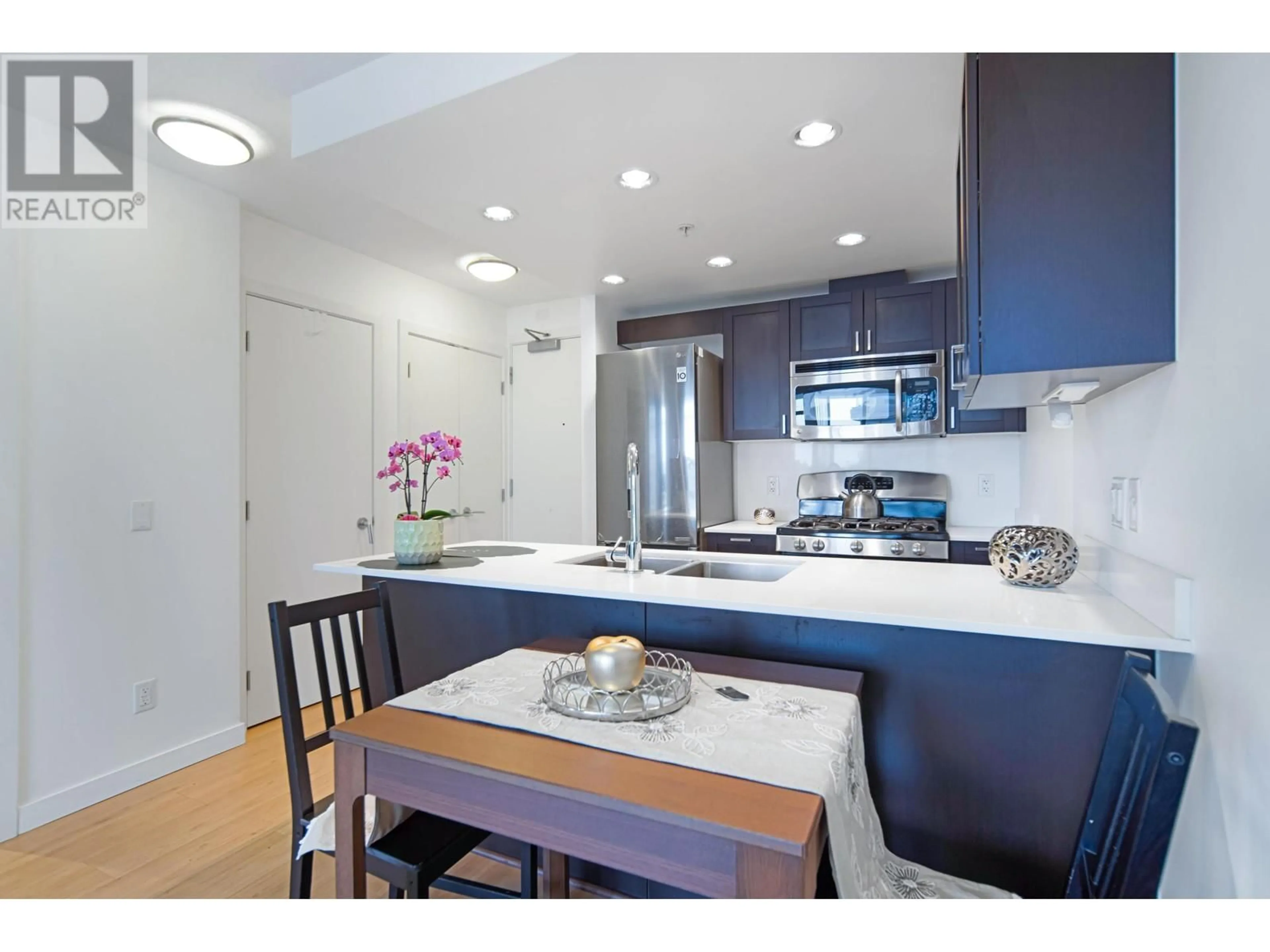 Open concept kitchen, wood/laminate floor for 608 - 4815 ELDORADO MEWS, Vancouver British Columbia V5R0B2